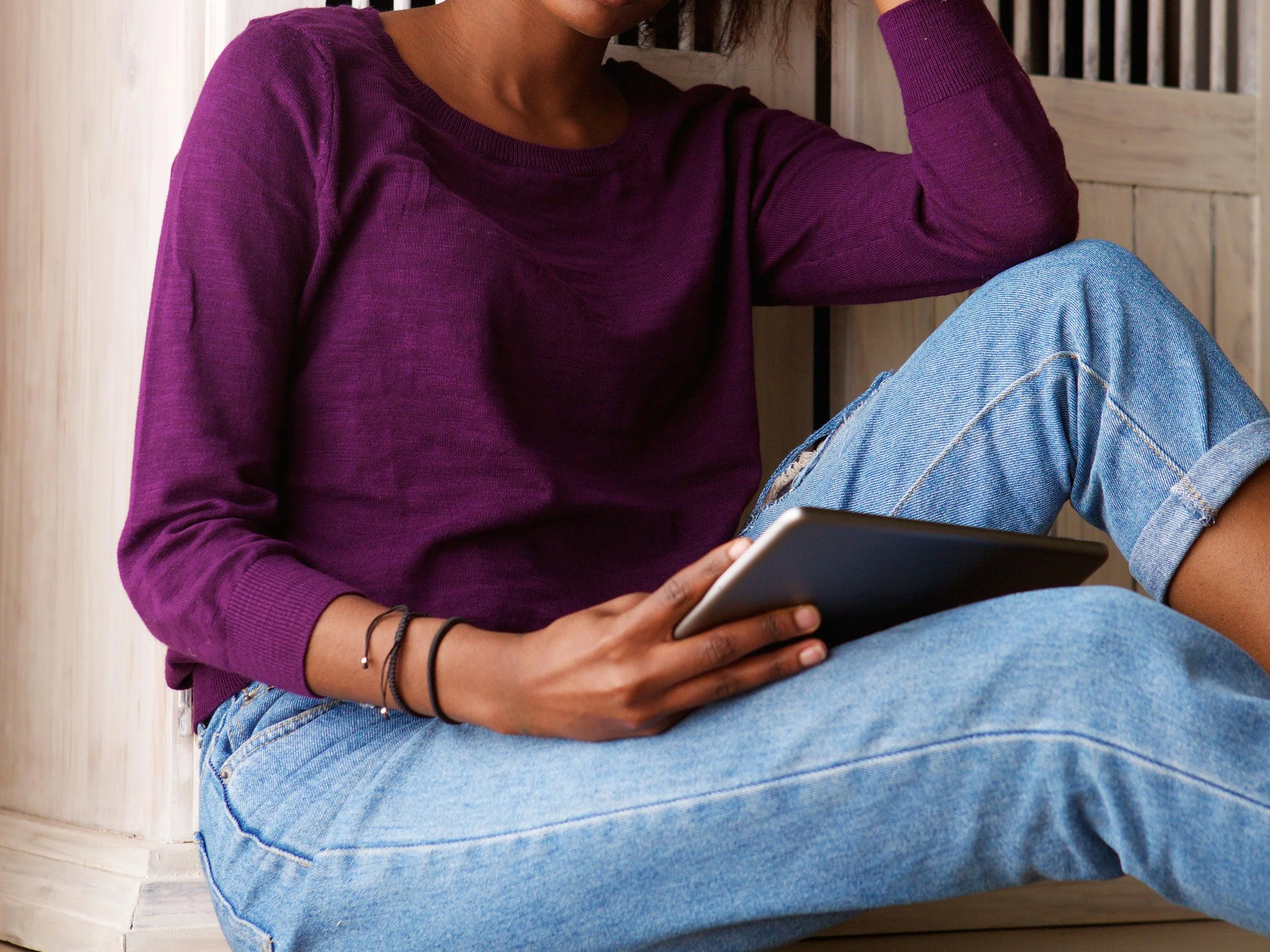 closeup of black woman using tablet