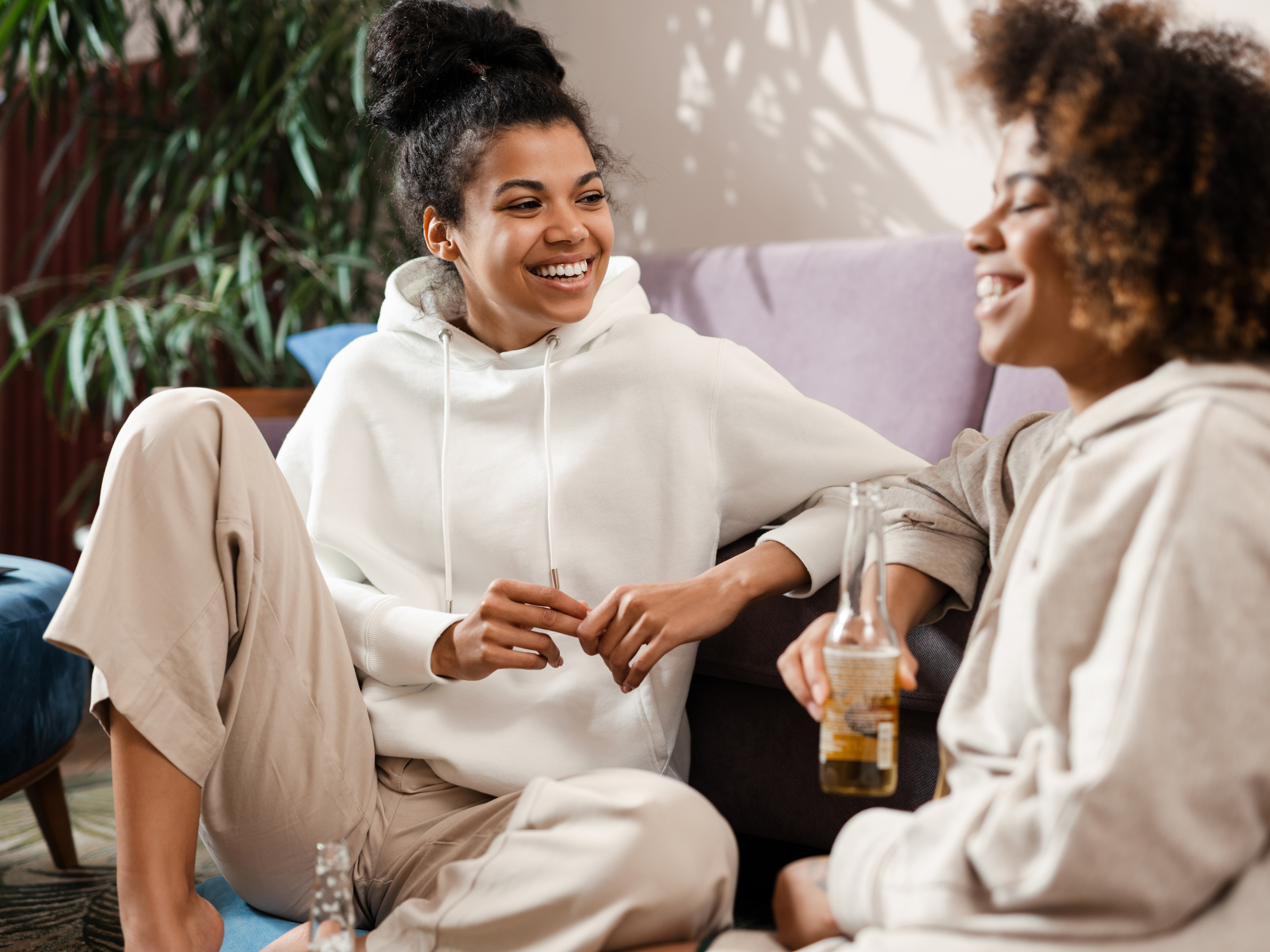 two black friends hanging out in house