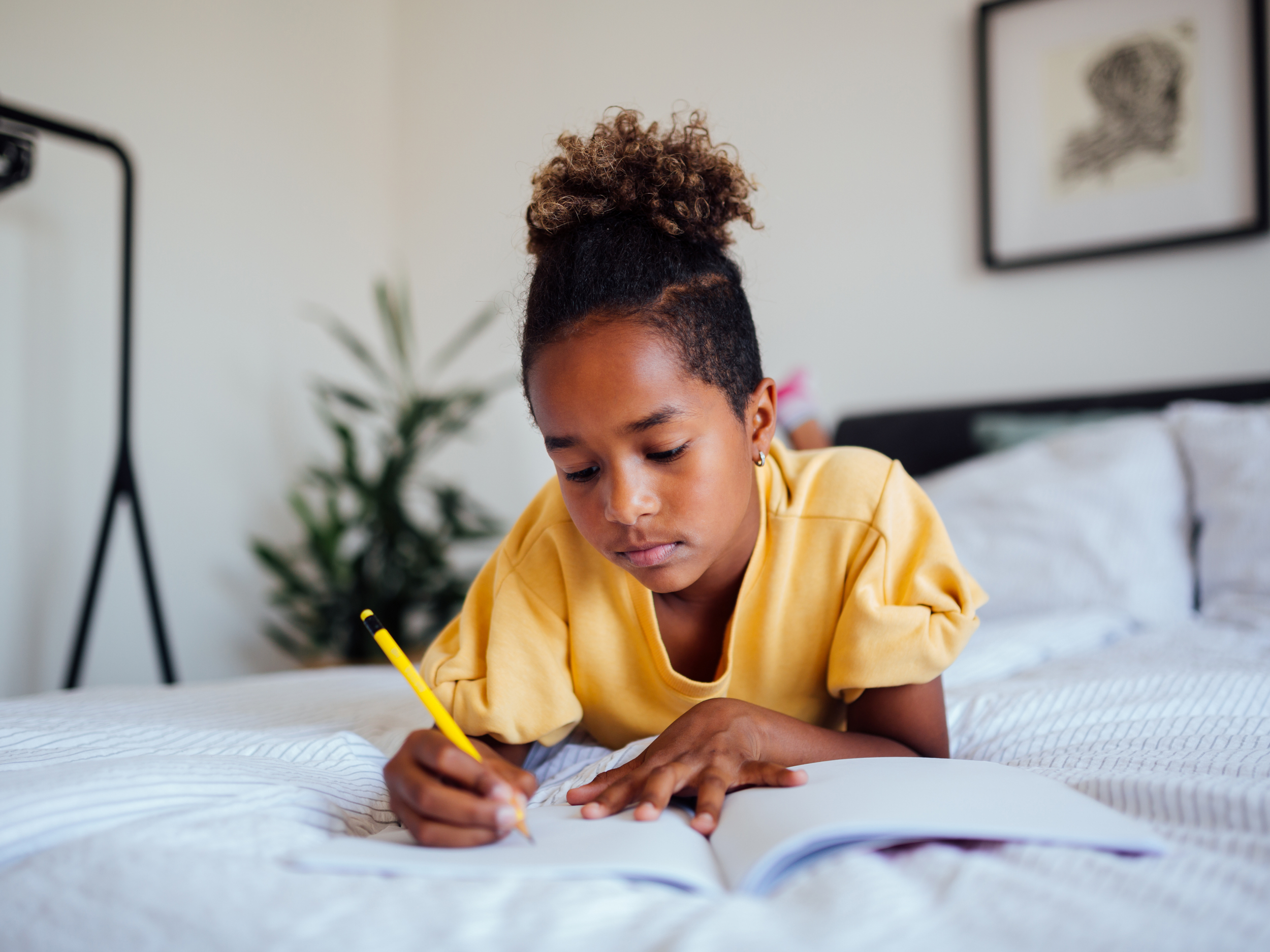 closeup of young black girl doing homework