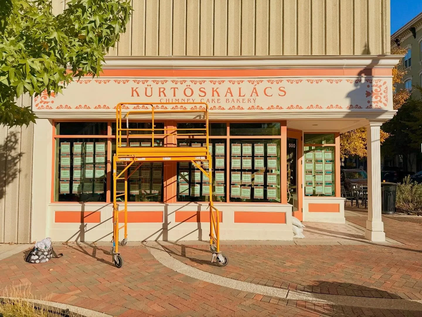 In honor of the recent grand opening of K&uuml;rtőskal&aacute;cs, I&rsquo;d like to share some more behind the scenes of painting their unique storefront. Going into it, I was so nervous (mostly to be 10 feet off the ground). But by the end, I was so