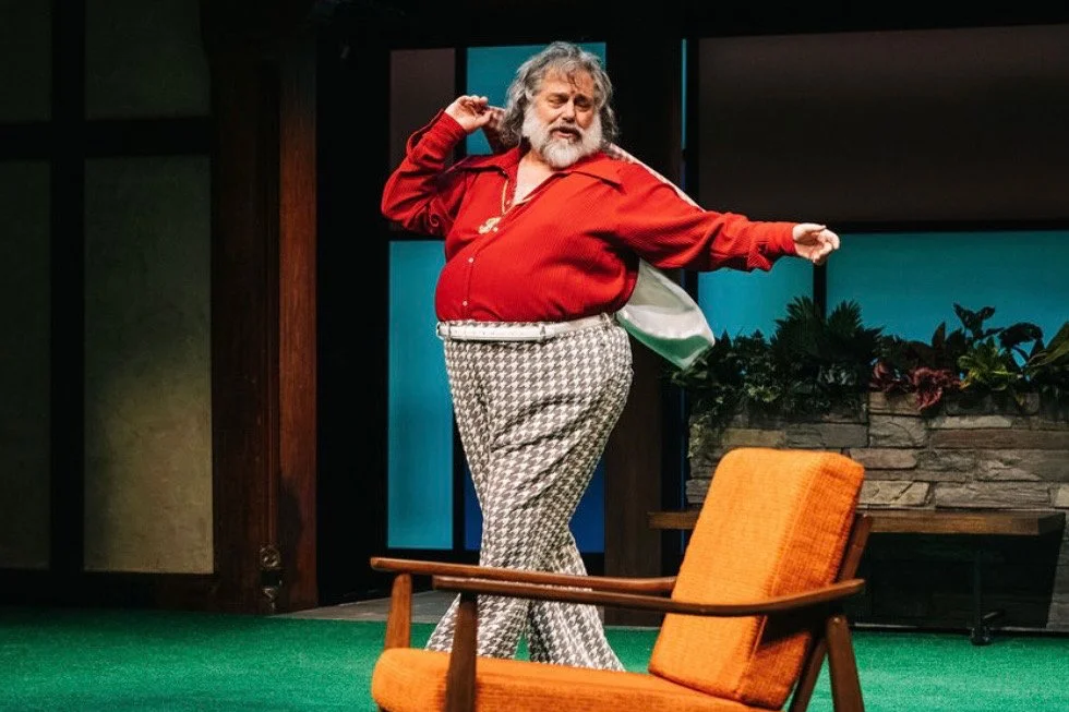 Brian Mani as Falstaff strutting across the room