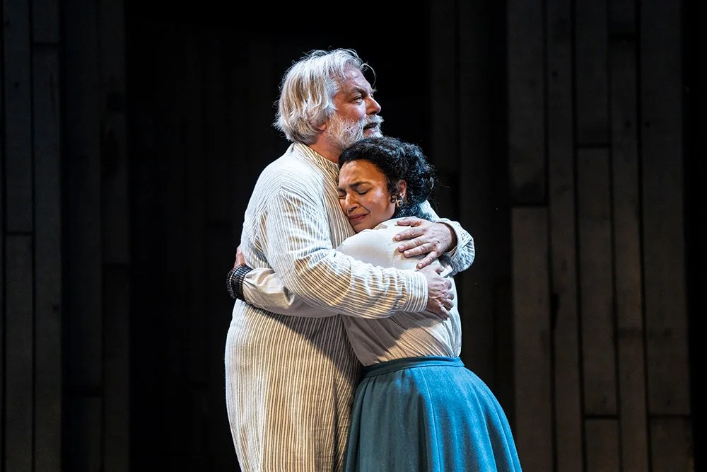 King Lear hugging his daughter