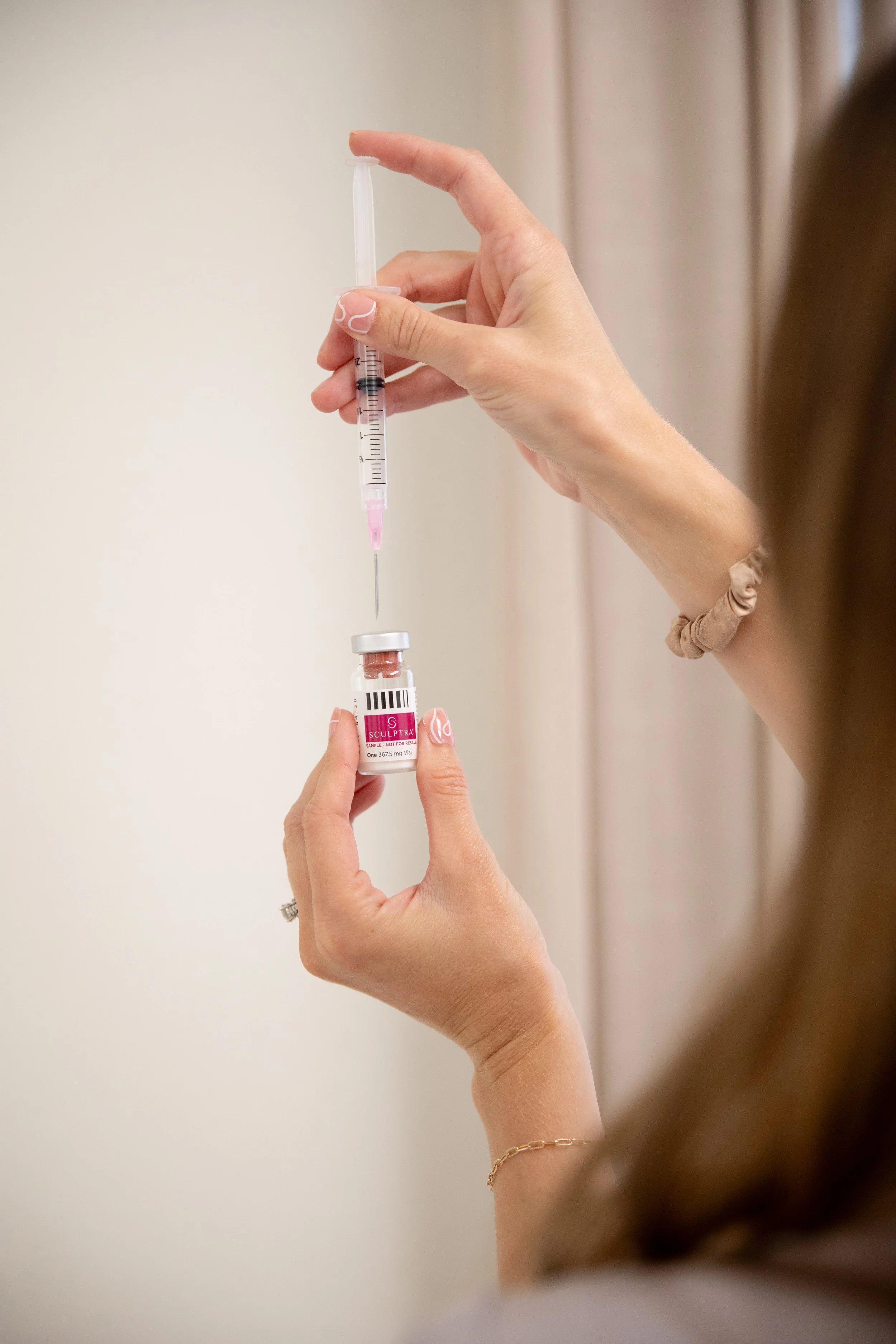 Provider pulling Sculptra out of vial in Atlanta, GA