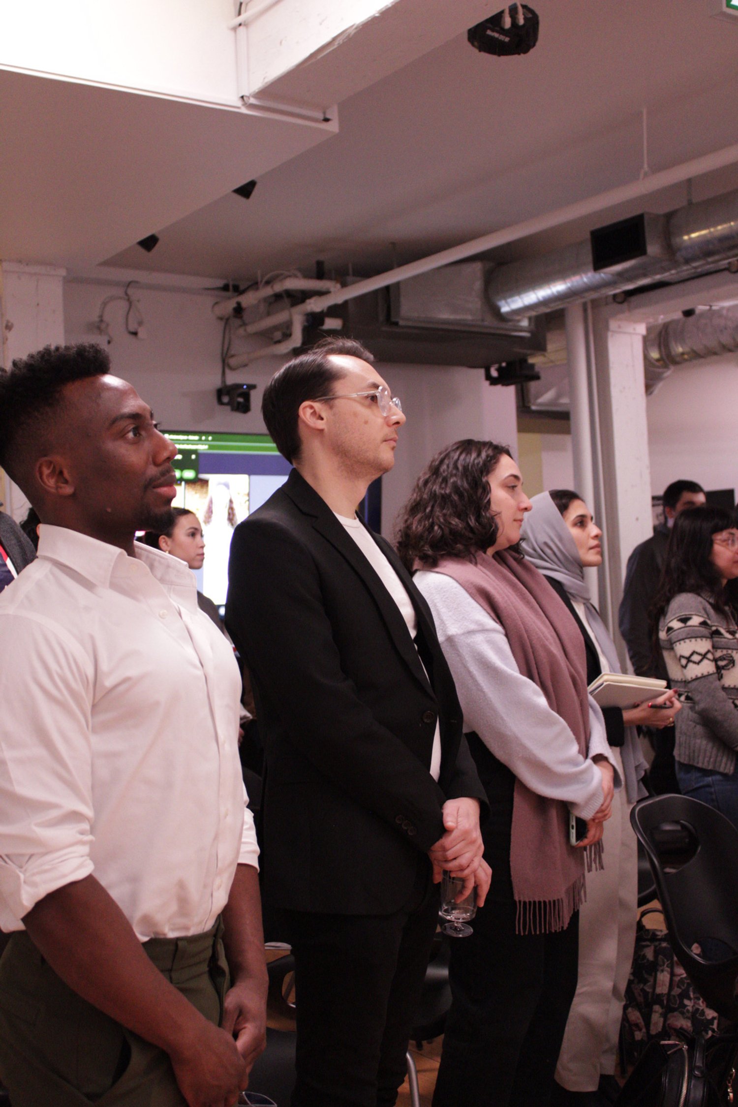 A picture of participants at the Alive House launch event, facing the stage at the beginning of the event