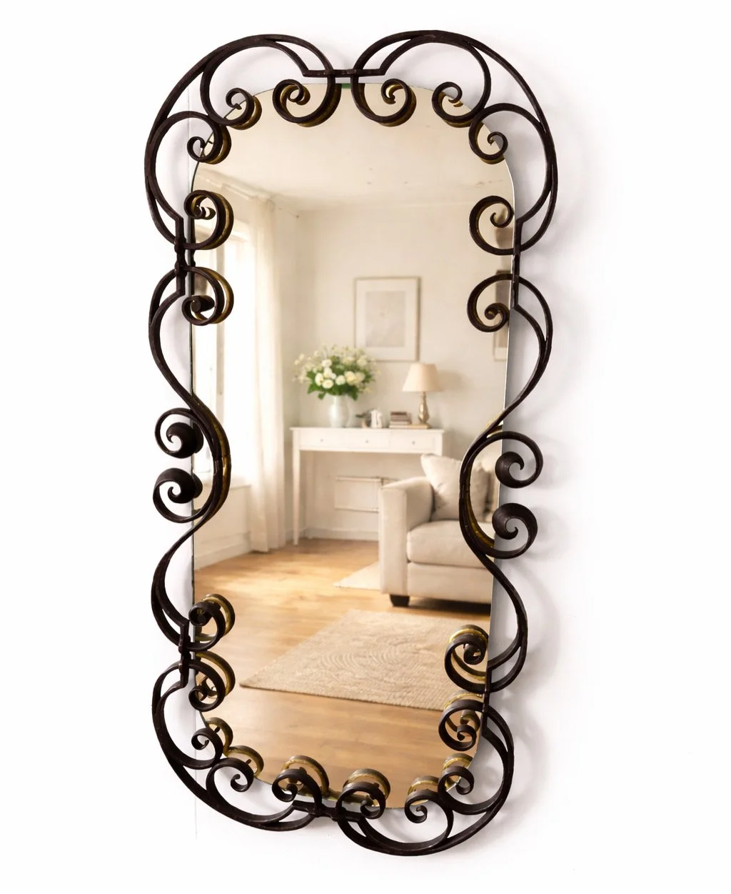 Bespoke hand-forged steel mirror with decorative scrollwork, combining traditional blacksmithing with sculptural interior metalwork.