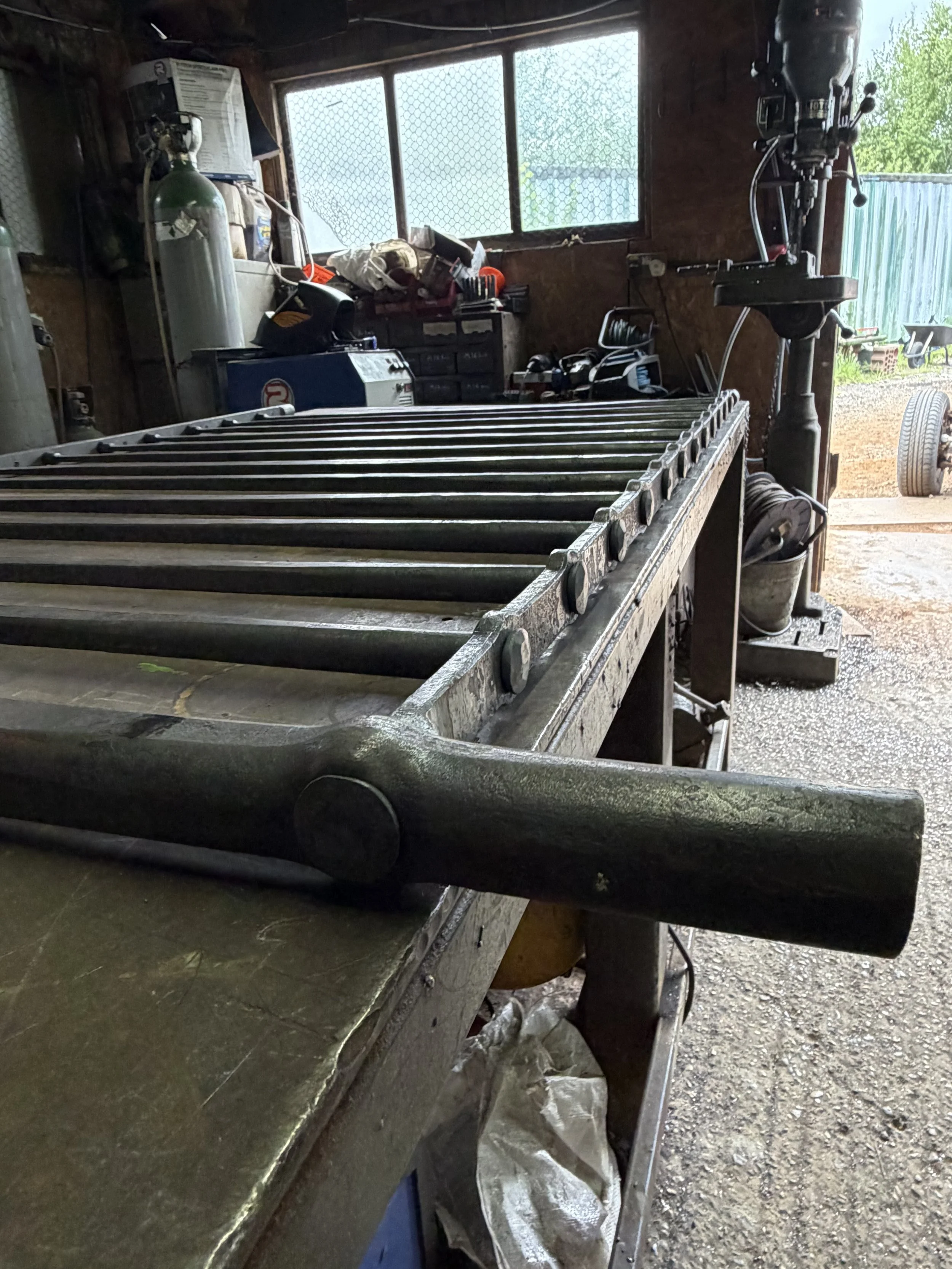 Bespoke steel balustrade being assembled in the blacksmithing workshop using traditional forged mortice and tenon joints