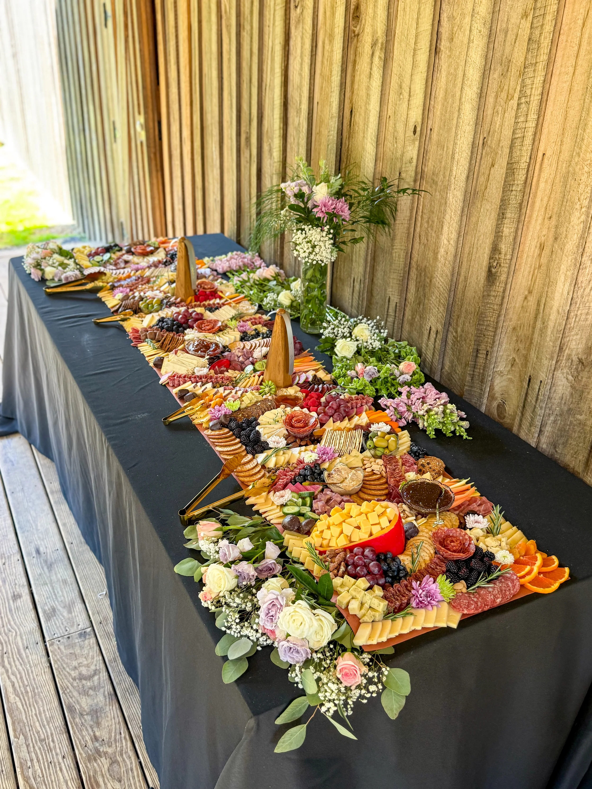 8 foot flat lay grazing table with fresh florals for a wedding