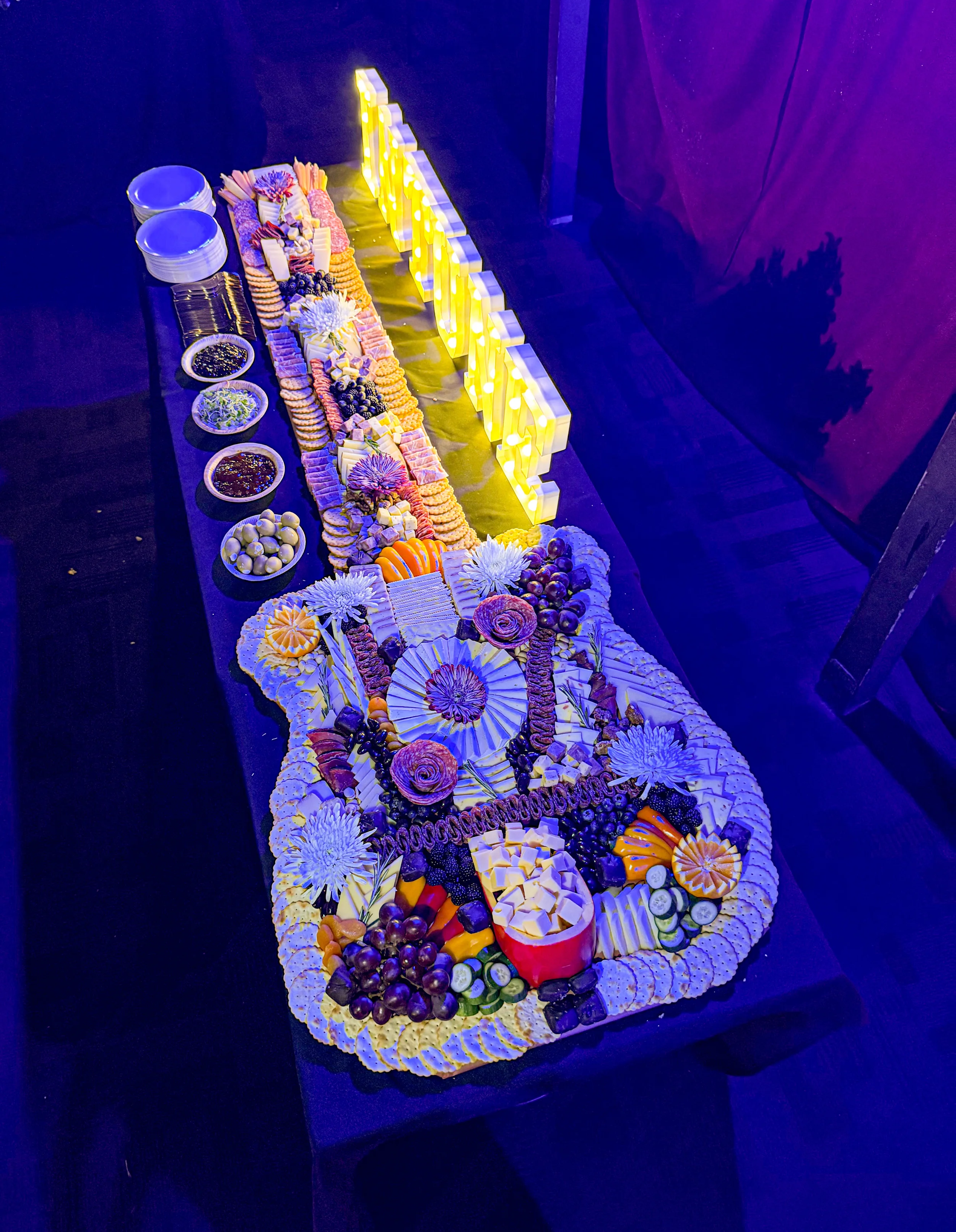 Guitar shaped grazing table at corporate event