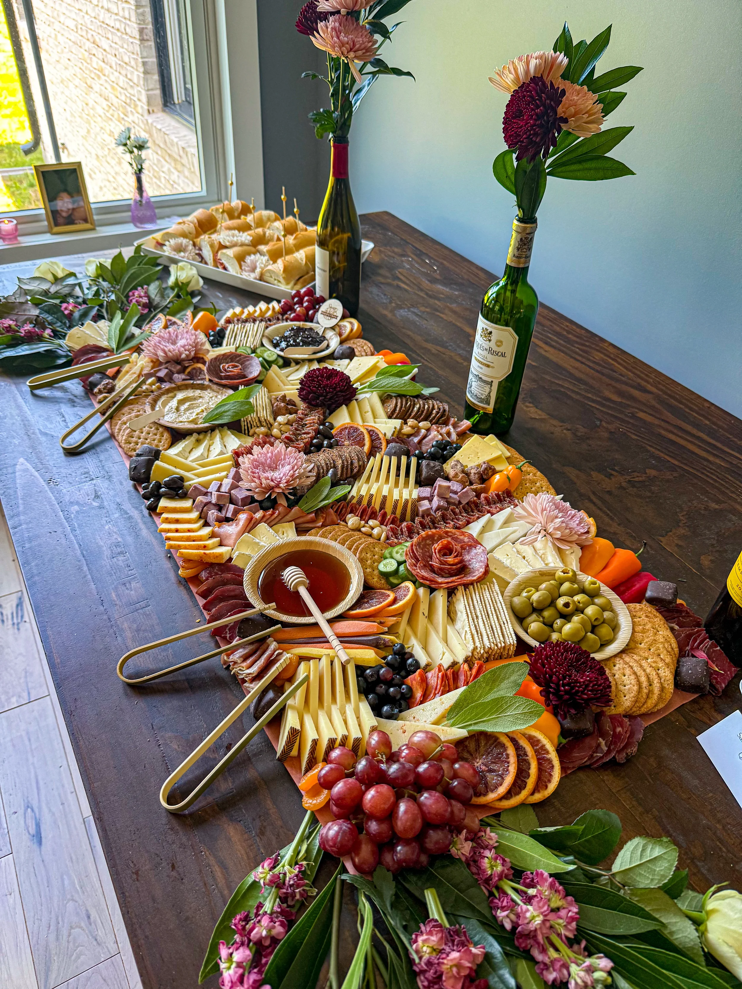 35 person flat lay charcuterie grazing table for a Vino Before Vows themed bridal shower 