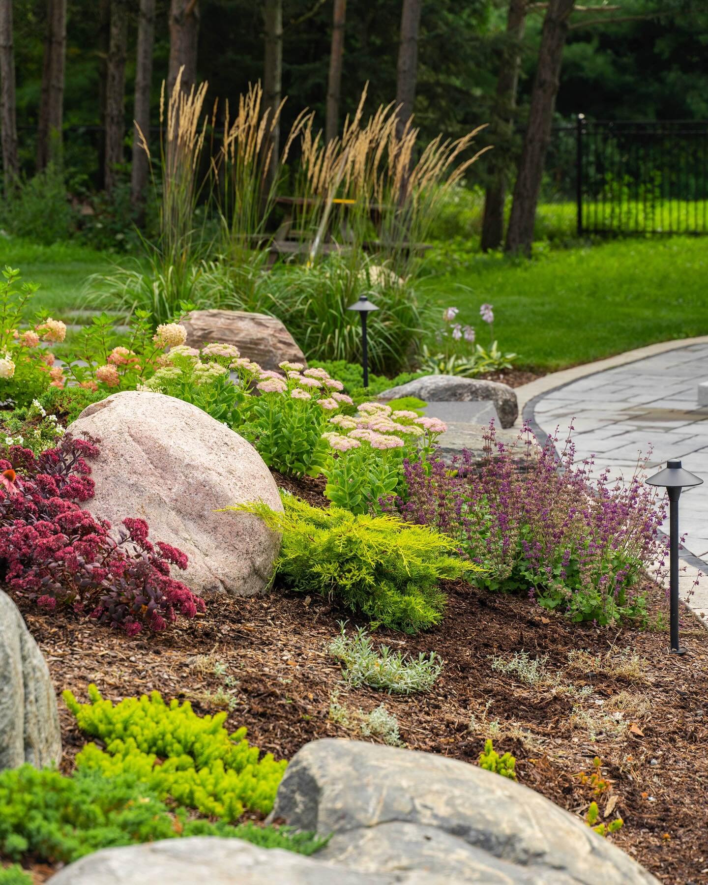 Delight is in the detail🌿

Whether it&rsquo;s an expansive estate or a quaint backyard, it&rsquo;s the details that make a landscape feel complete. 

Work and photo by @silverfernlandscape 

Products
&mdash;
Granite boulders
Brussels Block sandstone