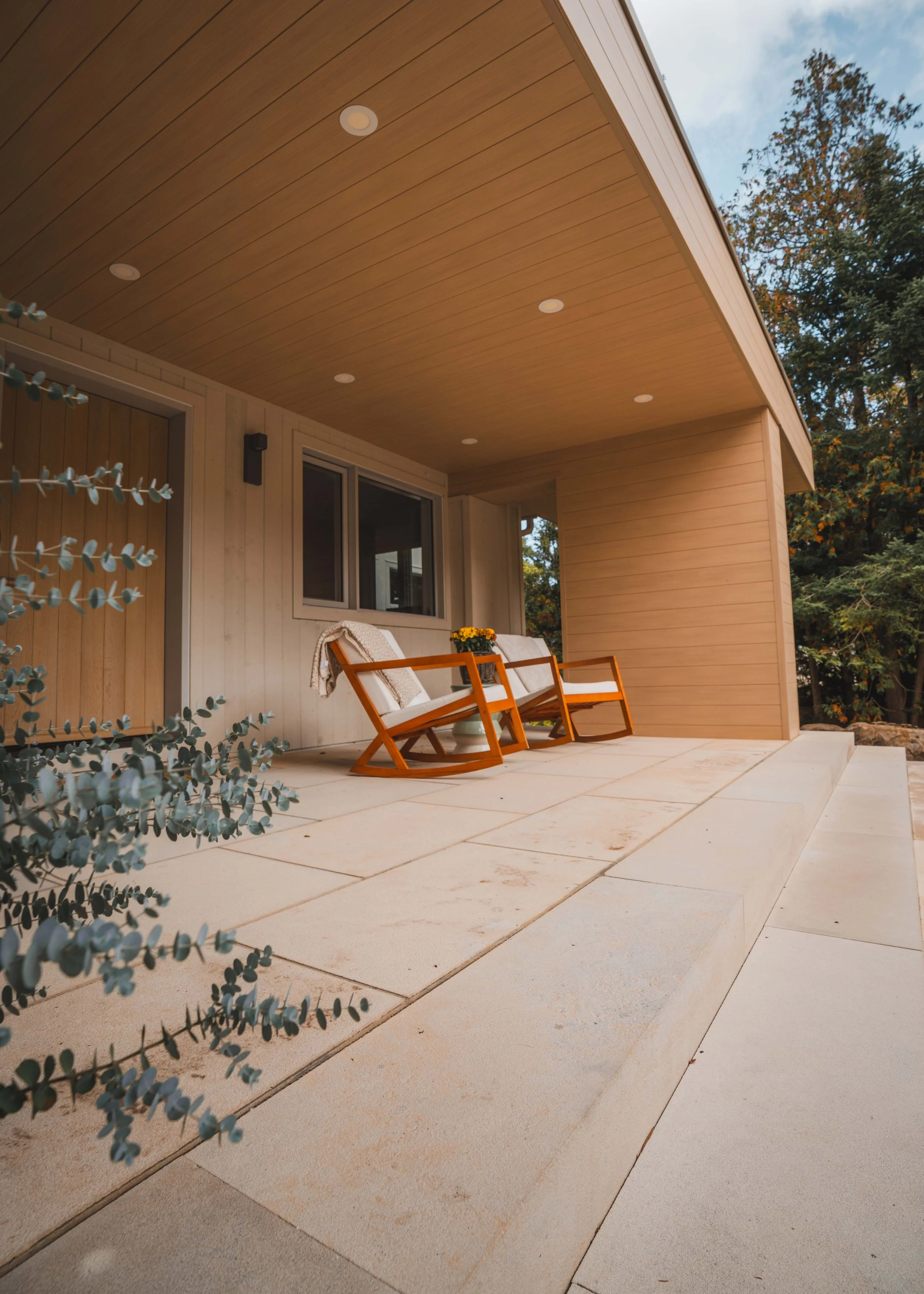 Natural stone patio slabs under a covered porch