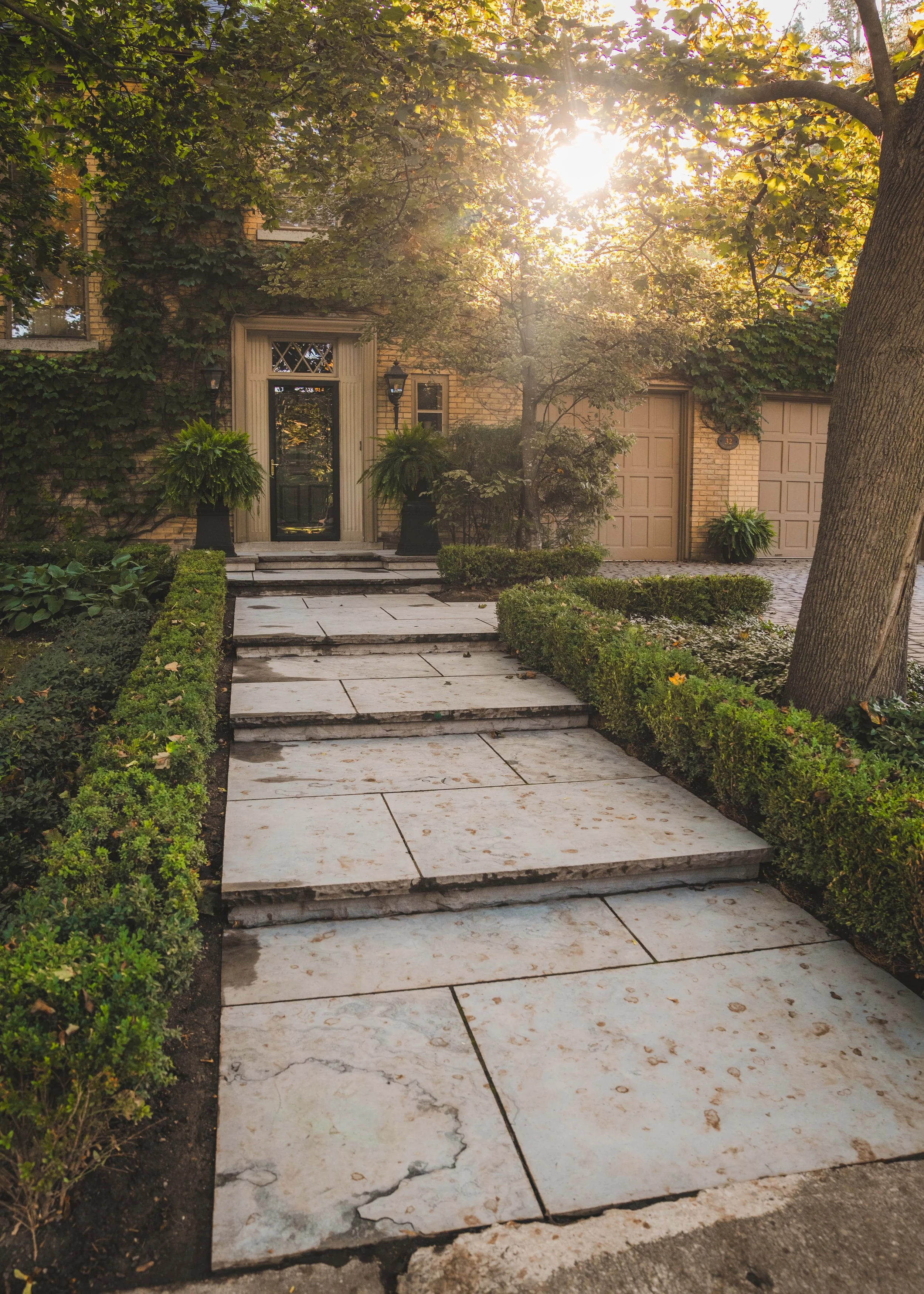 Natural stone Eramosa pavers leading up to a front door