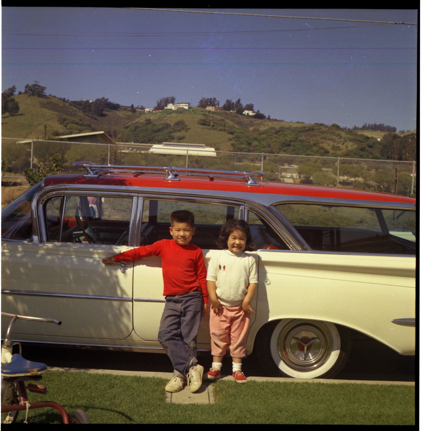 FINALIST
Gregory Han's circa 1962 photo of him and his sister, Lisa Marie in front of his family's 1958 Oldsmobile Super 88 station wagon parked in the driveway of their home at 1409 Norvell St. Castro Elementary School is in the background.