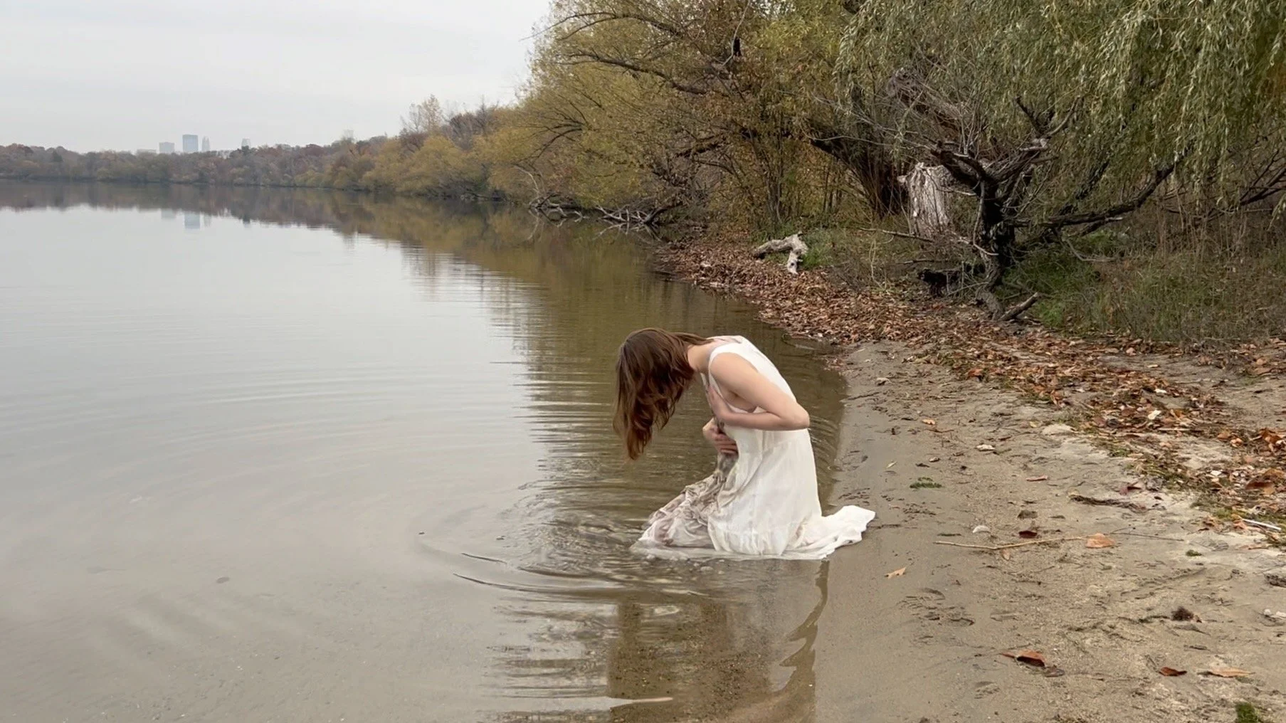 REBIRTH still from performance on the shores of Bdé Umáŋ (Lake Harriet)