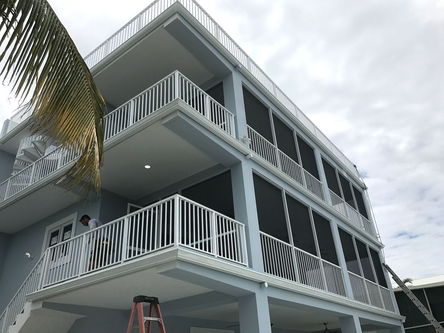 White seamless gutters and downspout on an elevated coastal home in the Florida Keys