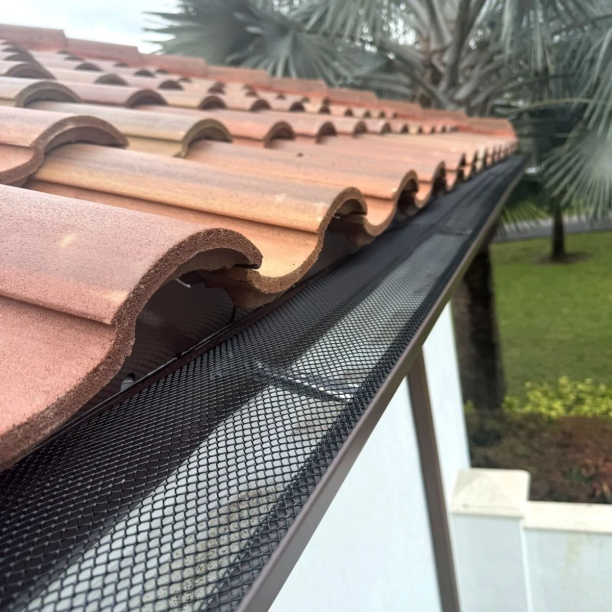 Gutter guard installed on a seamless gutter at a Miami home