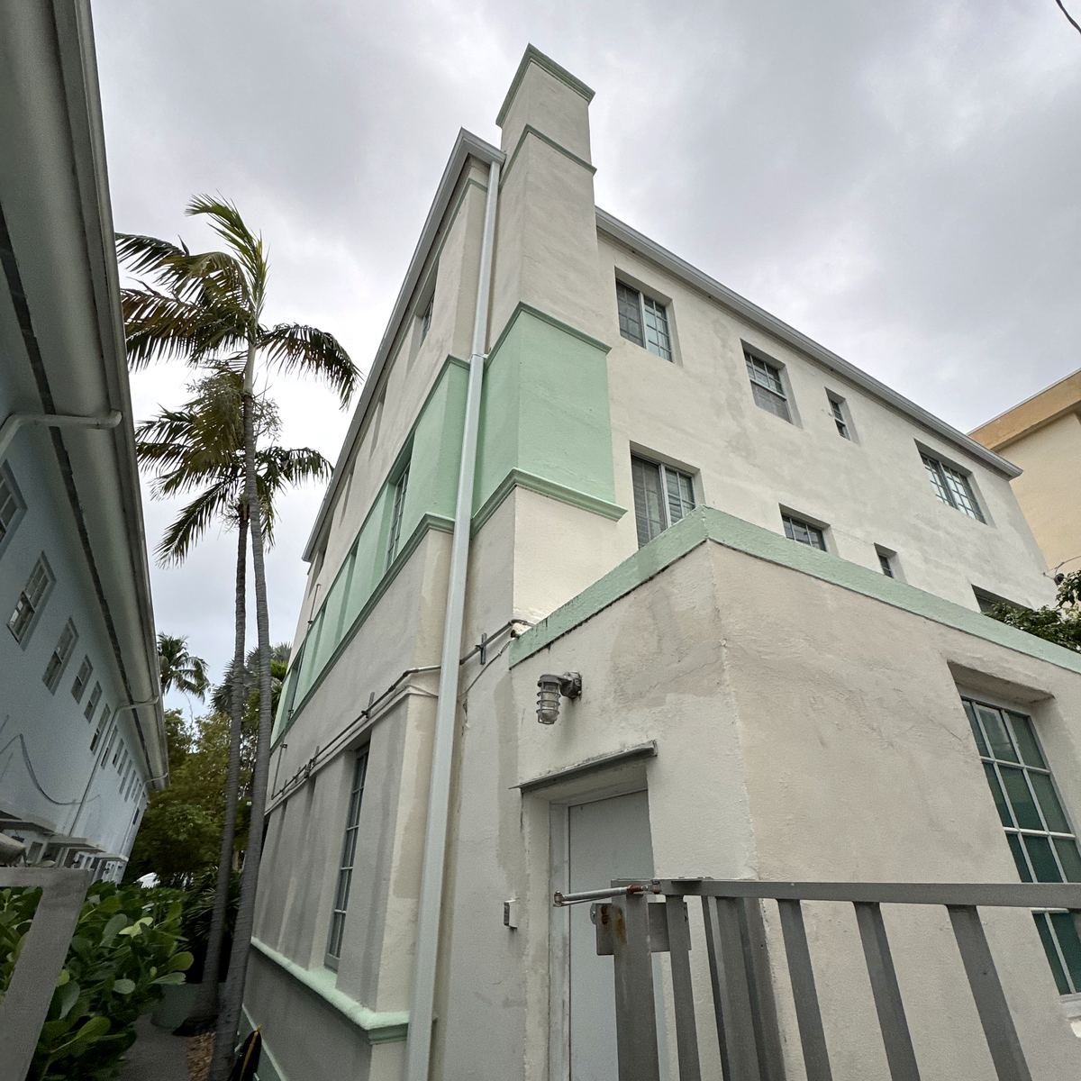 Oversized downspout on a South Florida commercial property directing water away from the entrance