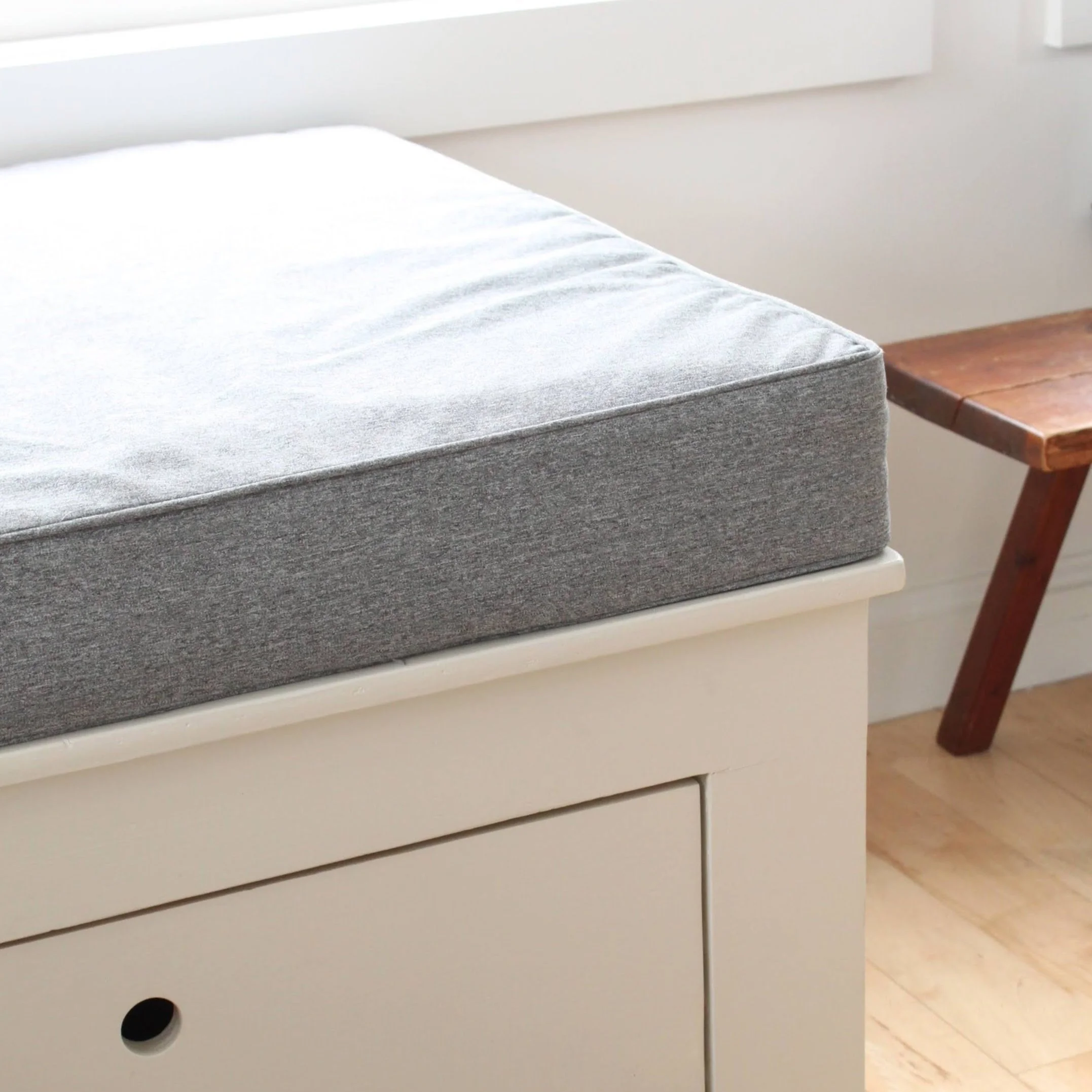 built in bench with storage and tailored cushions in home in Portland Maine