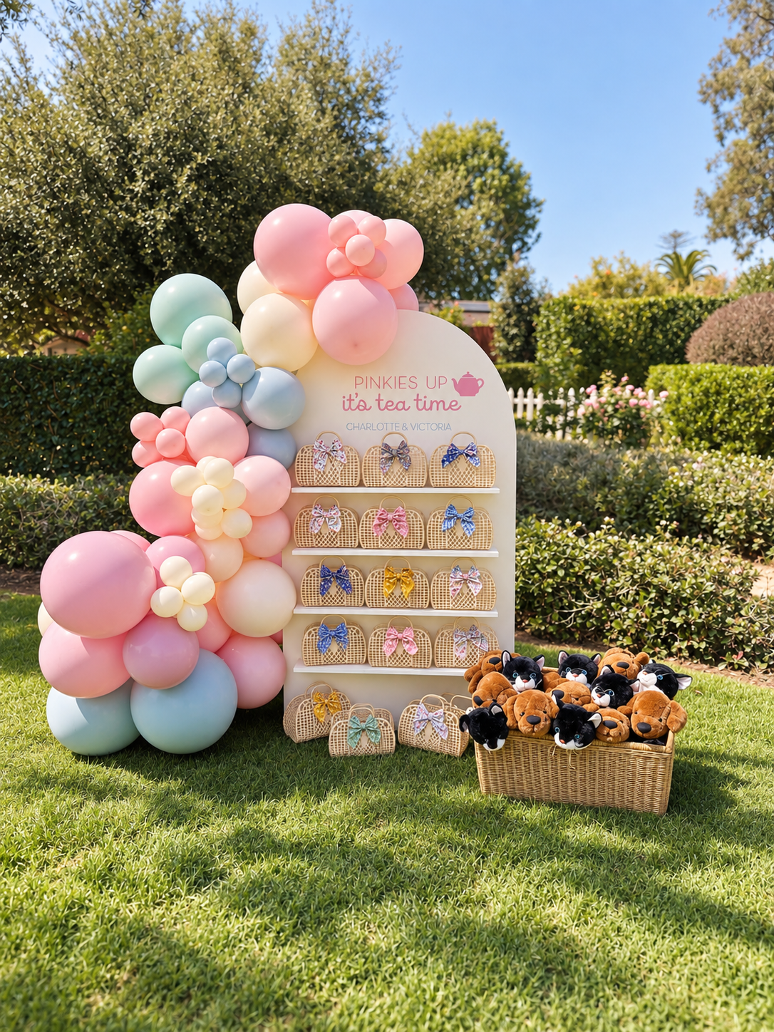 Decorative setup for Autumn's Dollhouse featuring a colorful balloon arrangement with purple, pink, mint green, and white balloons, a shimmering pink backdrop with the text 'Autumn's Dollhouse', and two cartoon characters: a cute, mermaid-like cat with a pink star and a girl with curly hair wearing animal ears, holding a white cat.