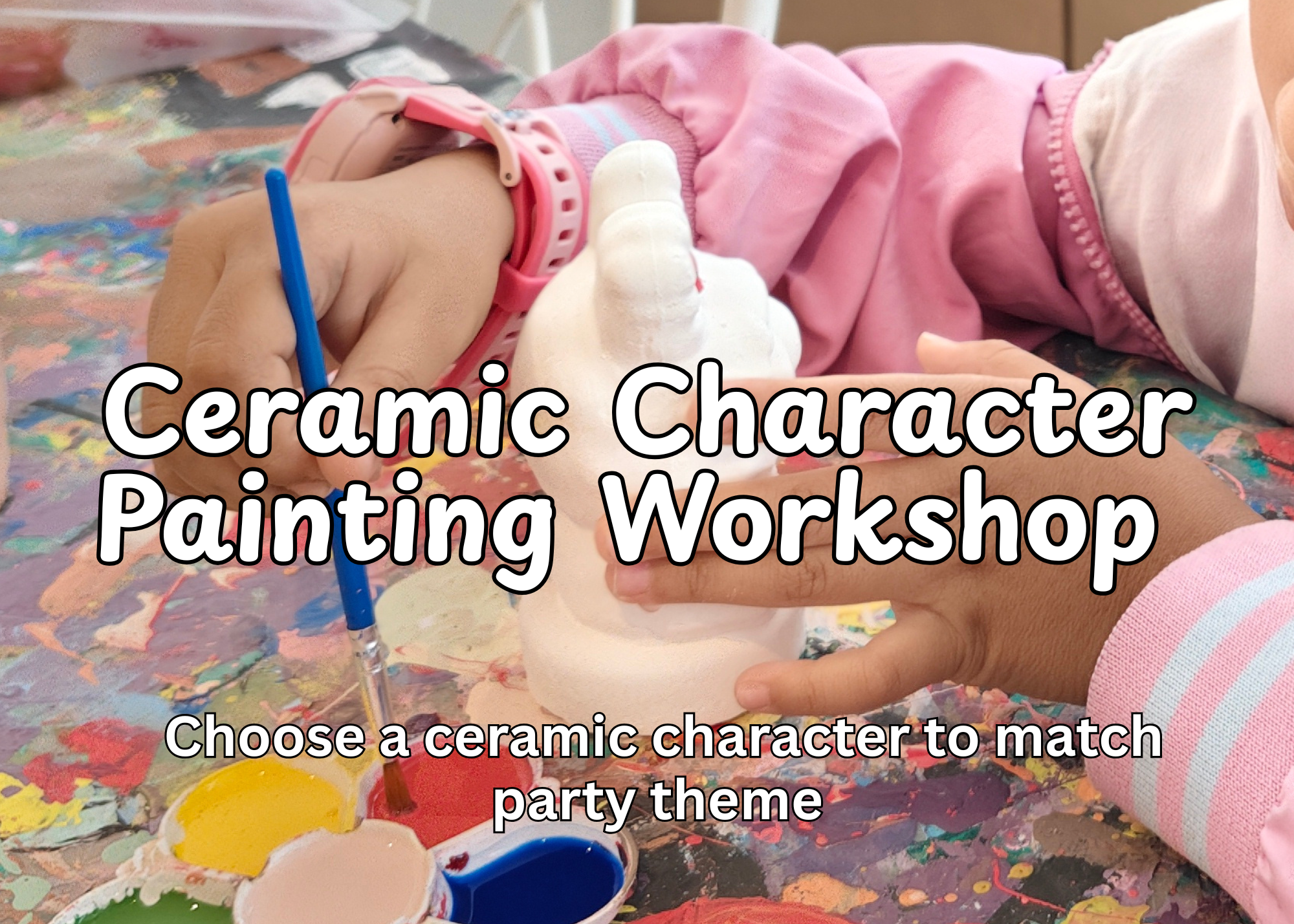 Child wearing pink and white clothing painting a ceramic character with a paintbrush at a crafting table.