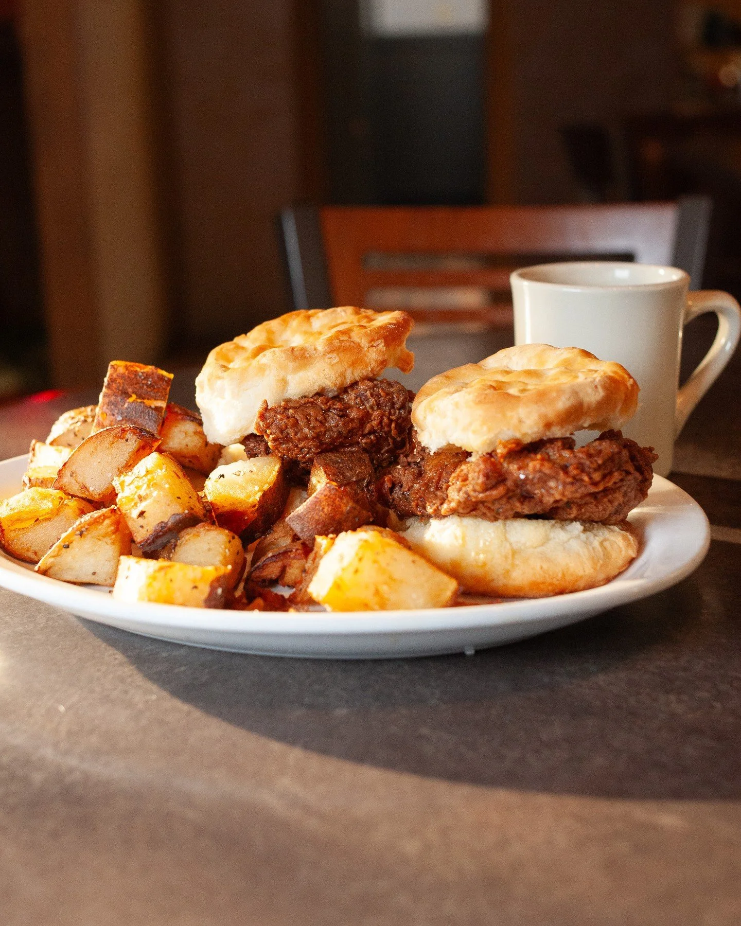 Double the biscuits, double the breakfast magic ✨️🔮⁠
⁠
Buttermilk fried chicken breast glazed with honey and served on warm honey-buttered biscuits.