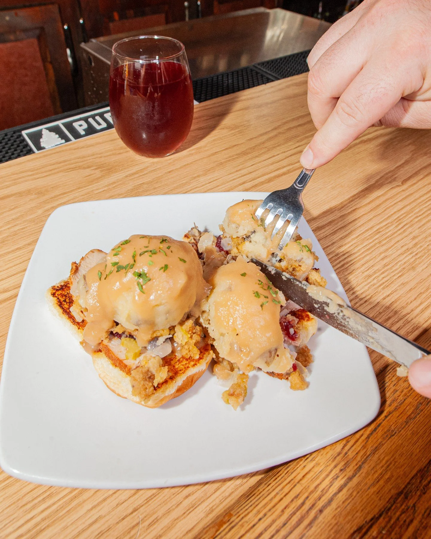 The Leftovers &quot;Benny&quot; is on deck through the weekend while supplies last! ⁠
⁠
Open-face Hawaiian roll. Turkey. Cranberry sauce. Stuffing. Mashed potatoes. Gravy over everything. Mmm.