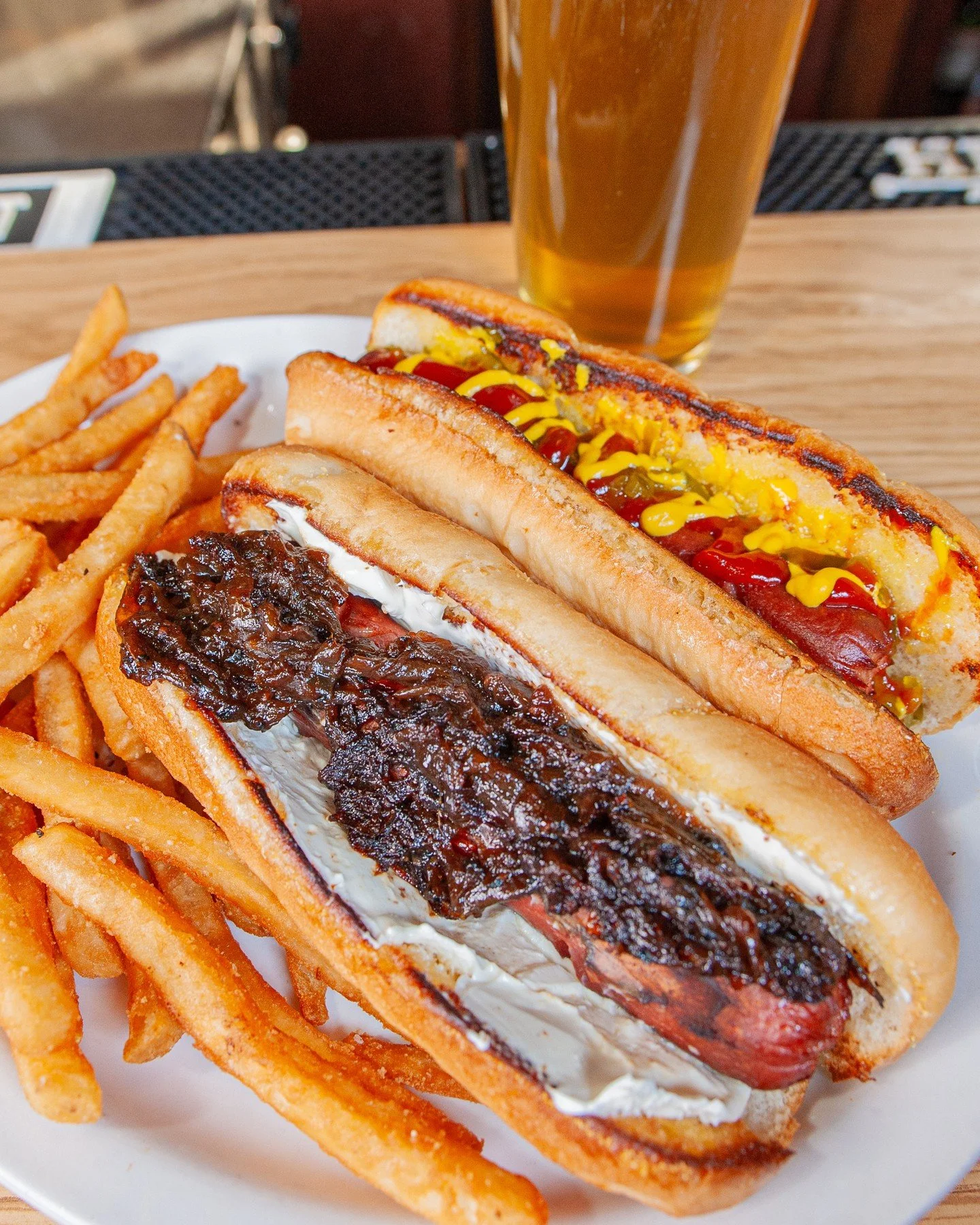 🌭 Our Hot Dog Platter is wussup, doggies!! 🌭⁠
⁠
Grab two all beef hot dogs on toasty buns with your choice of ketchup, mustard, relish, and mayo, plus fries (or any other dinner side) for $15. ⁠
⁠
Then, top 'em off as you please!⁠
✨️ Raw onion, sau