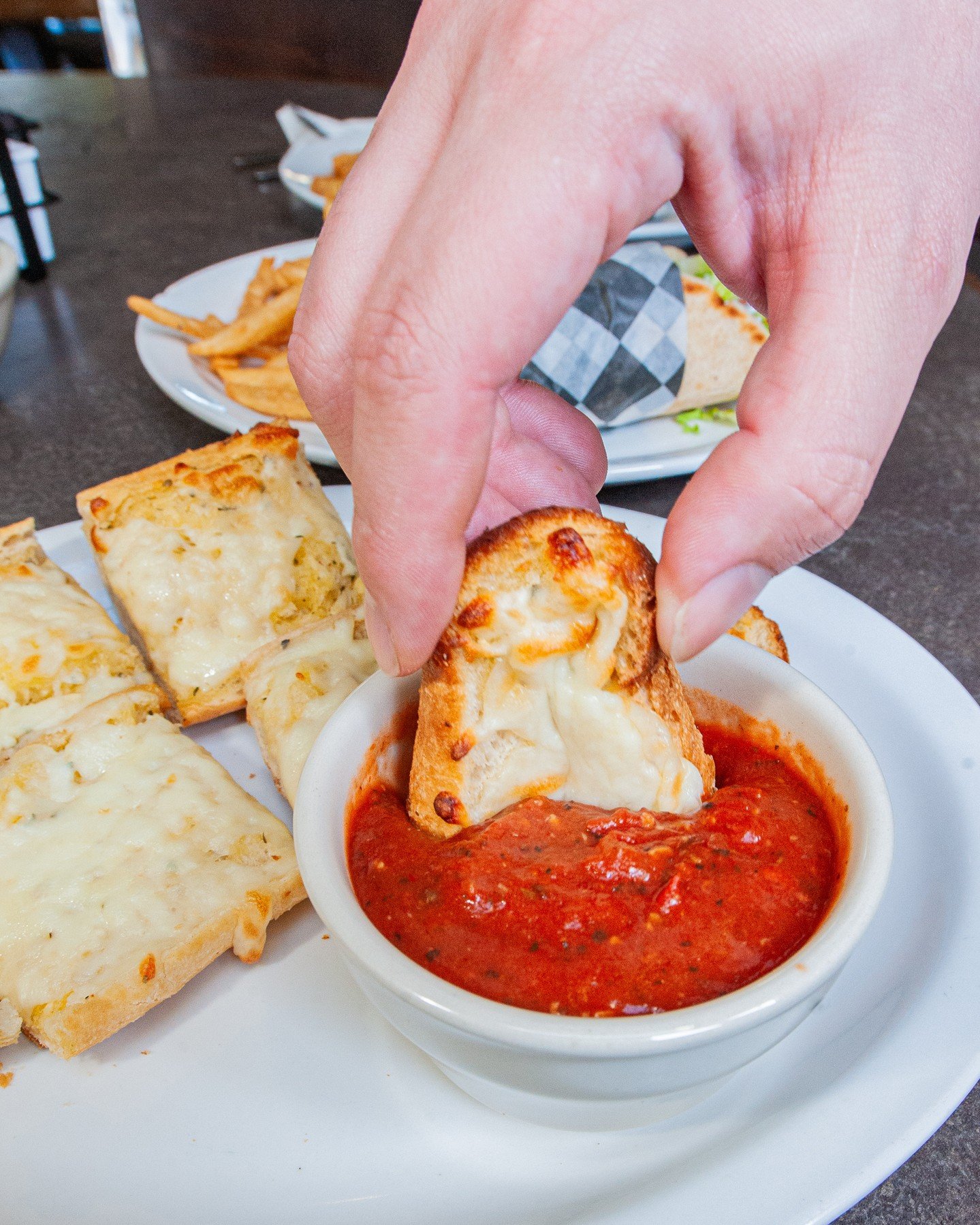 When I dip, you dip, we dip! ⁠
⁠
Grab some cheesy garlic bread to go with dinner! Oven-toasted with house-made garlic butter topped with mozzarella cheese and served with marinara 🍅⁠
⁠
Dinner is served daily from 3pm-9pm!