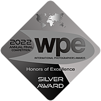 A silver award plaque for the 2022 WPE Annual Final Competition International Photographers Awards honoring excellence, featuring a map outline and text indicating the award is a Silver Award.
