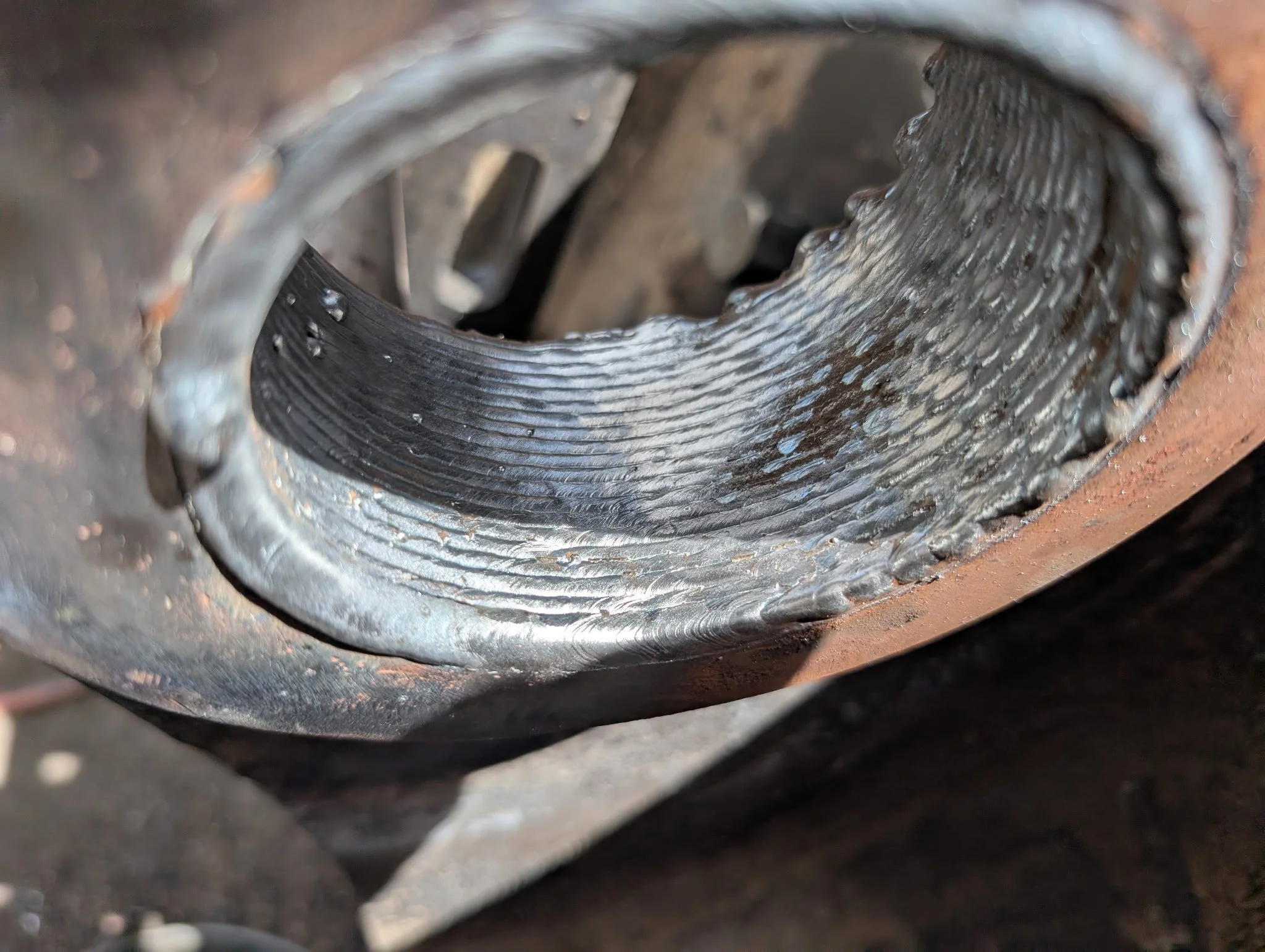 Interior welds to build material before line boring a piece of heavy equipment in Fresno