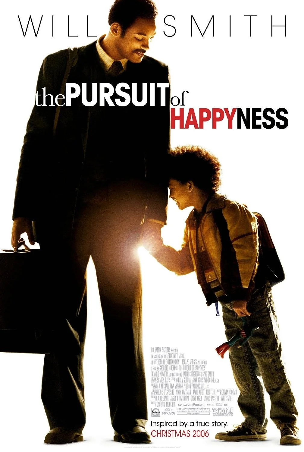 A man and a young boy holding hands, smiling, with the boy holding a small tool. The image is a movie poster for "The Pursuit of Happiness," featuring Will Smith, with the text "Inspired by a true story. Christmas 2006."