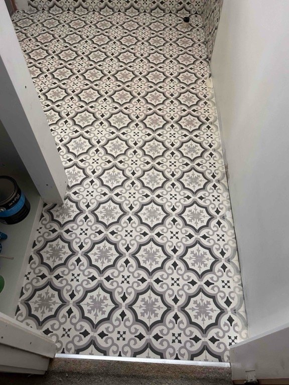 We removed old vinyl flooring, installed tile and slate underlay and new 600 x 600 floor tiles including tiled skirtings. Photo's taken before our plumbing partners re instated sanitary wear in bathroom