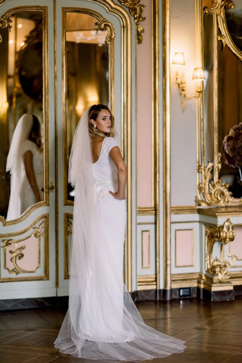 Beautiful bride in an elegant wedding dress inside the five-star Villa Cora in Florence , a stylish Italian wedding planned with attention to detail by FunkyBird Weddings.