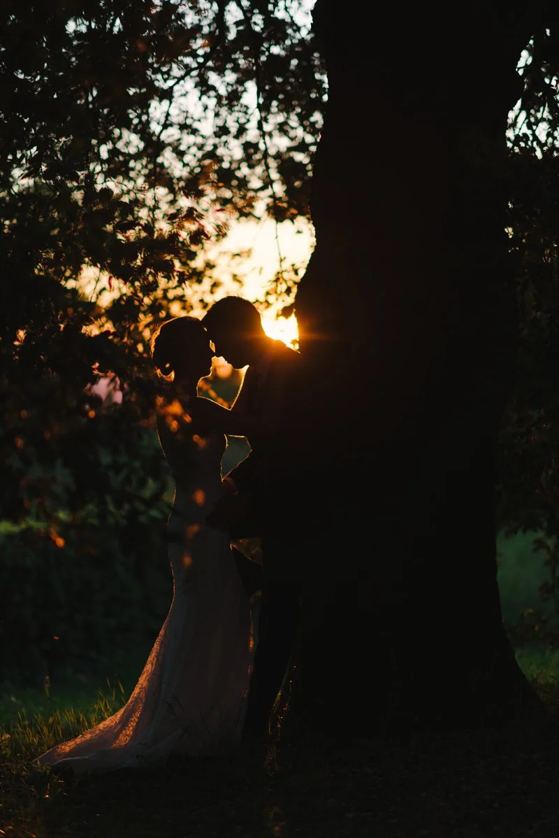 Couple kissing at sunset at Tuscany wedding shoot at one of the most beautiful Villa in Tuscany close to Florence