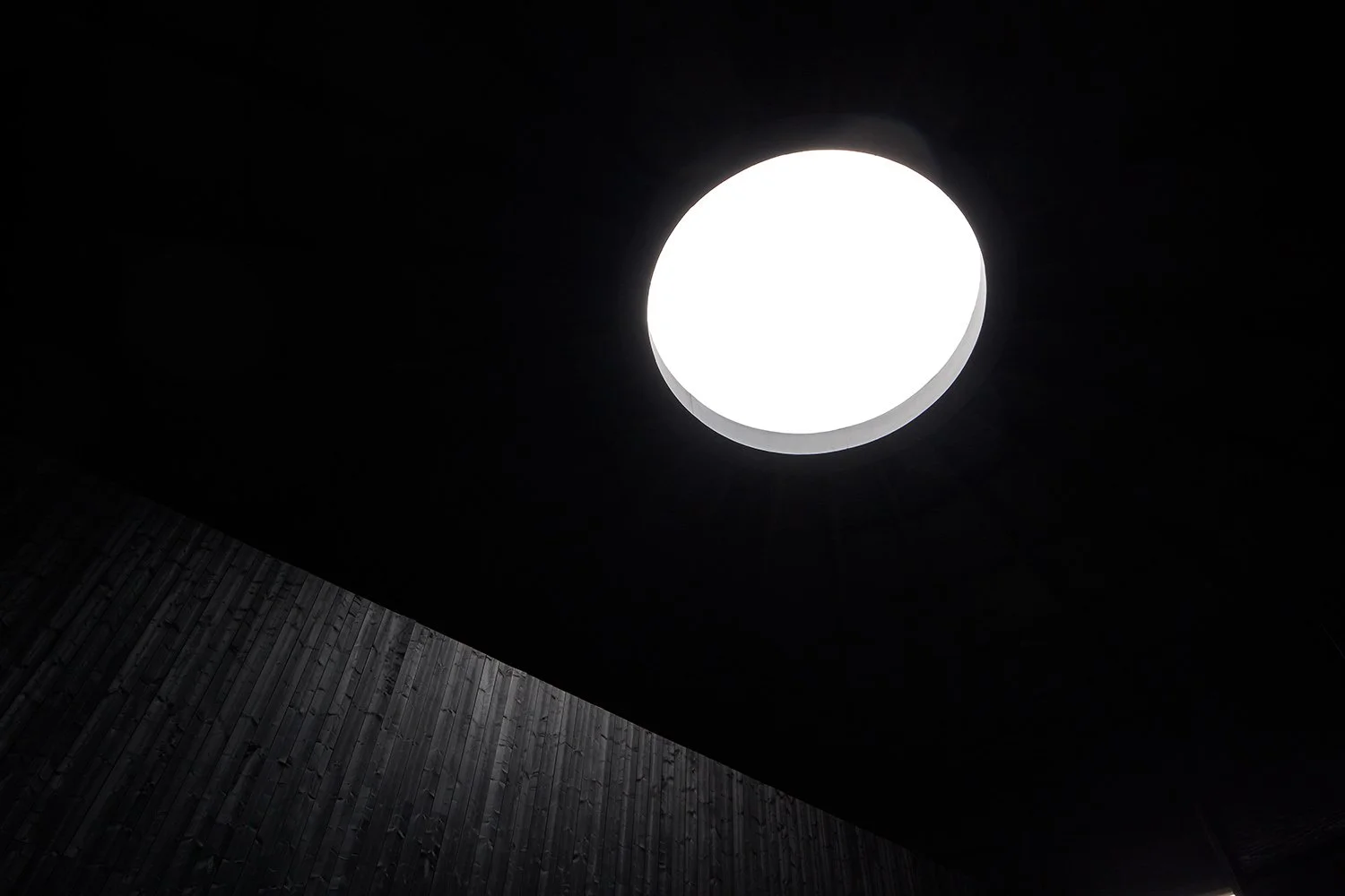 Circular skylight in a dark ceiling