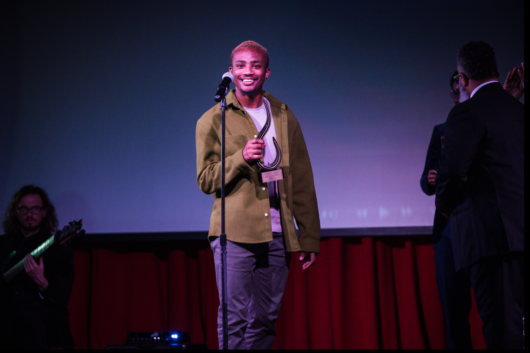 Producer Charles Jackson Jr. accepting an award on behalf of Jubilee Theatre at the 2023 Irma P. Hall awards.