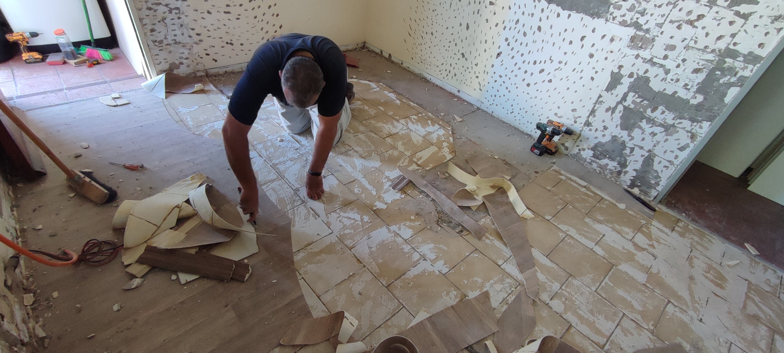 Stripping old Vinyl and tile flooring