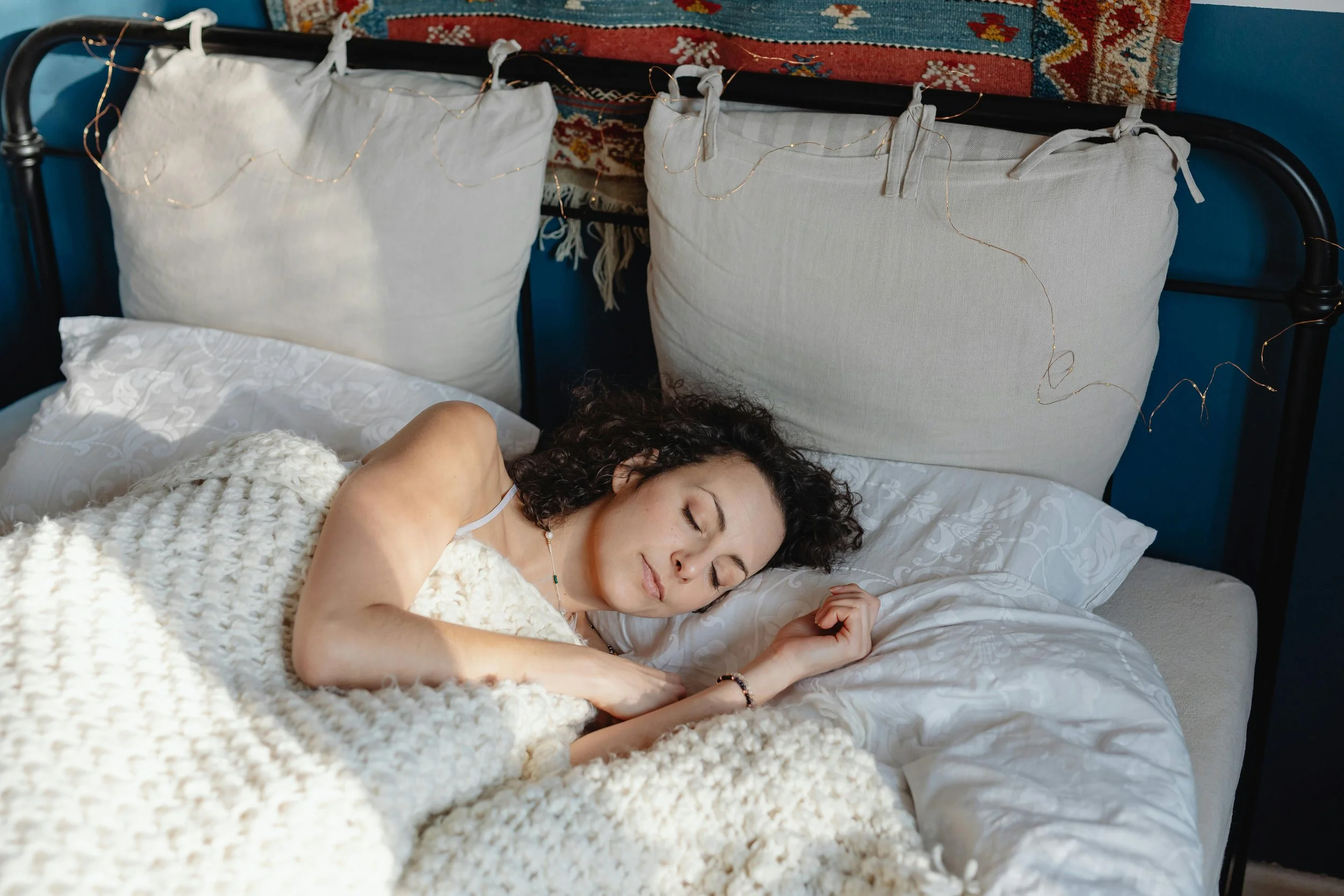 Woman sleeping in a bed