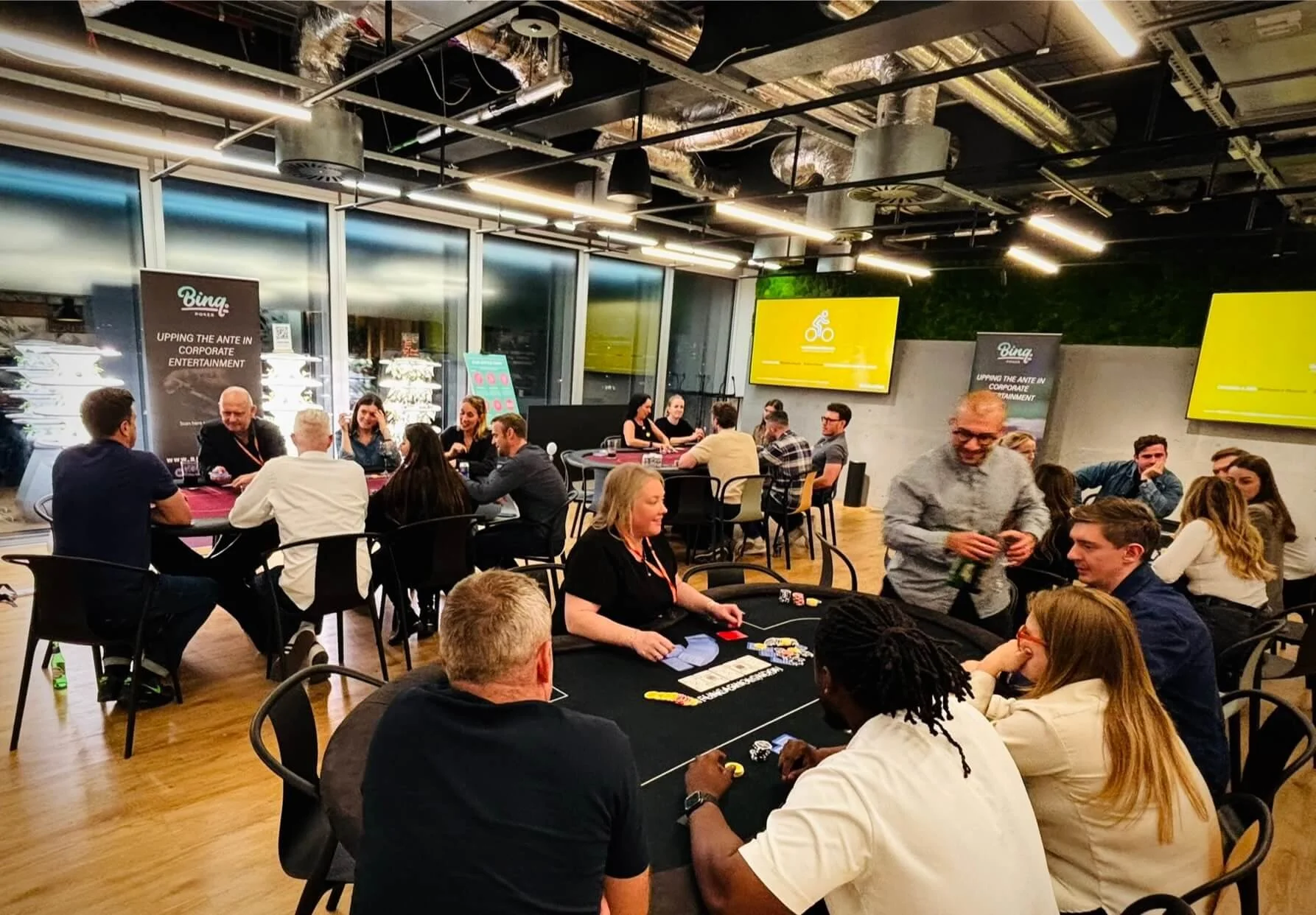 Professional poker tables set up for a corporate team-building event