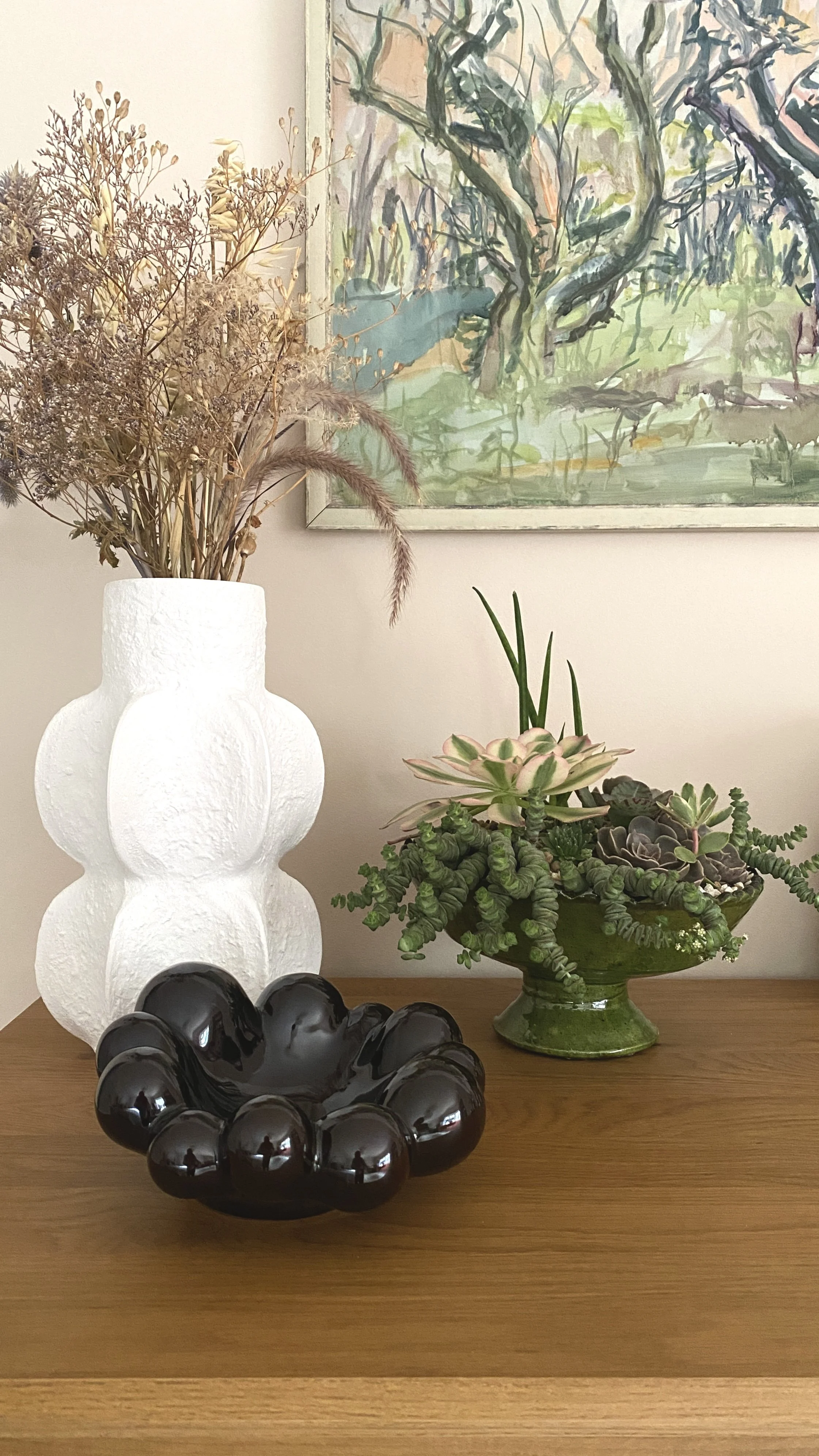 Interior designed vases sourced for a master bedroom with bespoke floristry