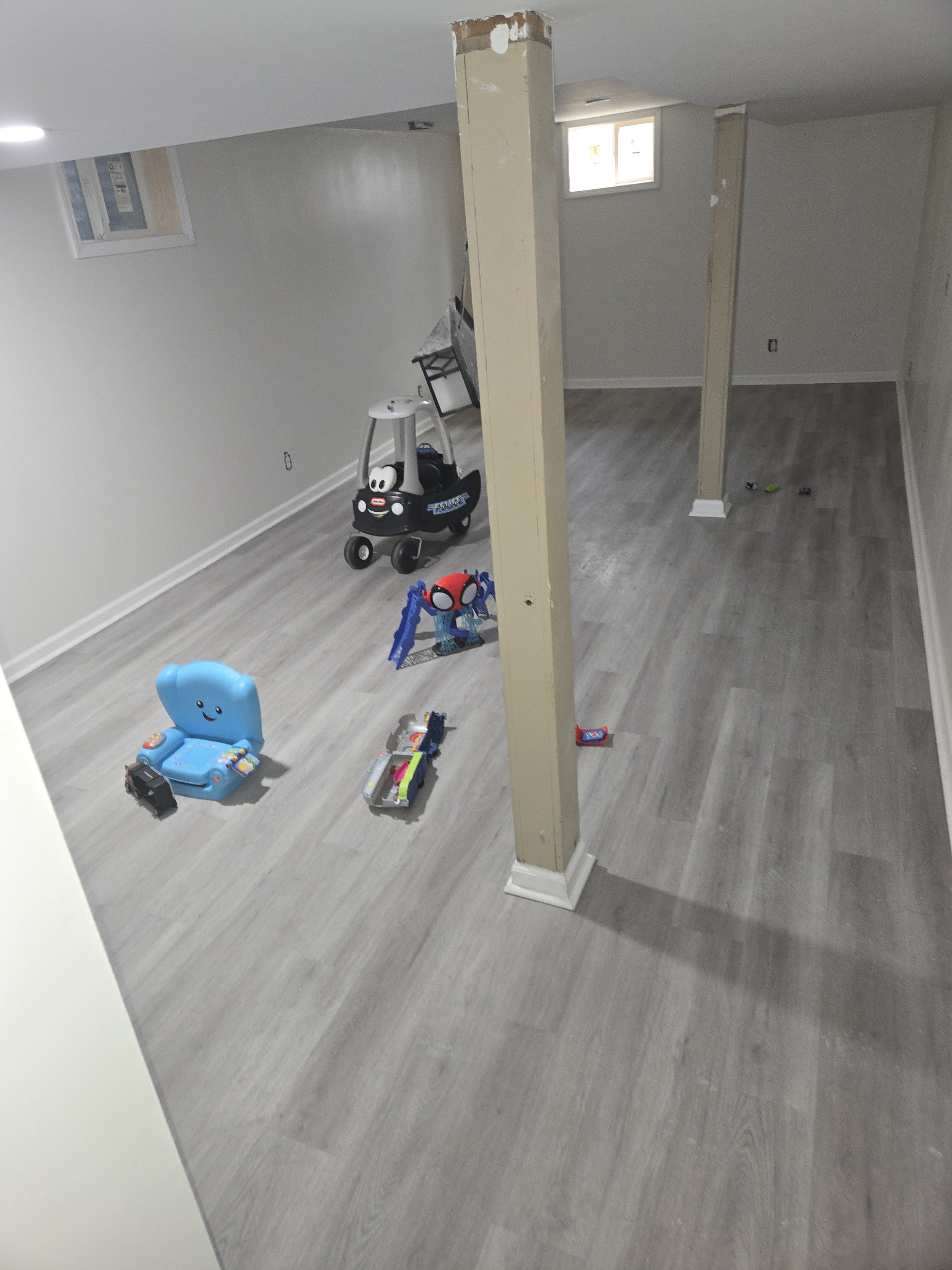 Drywall, trim, window casing, and glue down LVP. Finally gives the kids a place to play!
