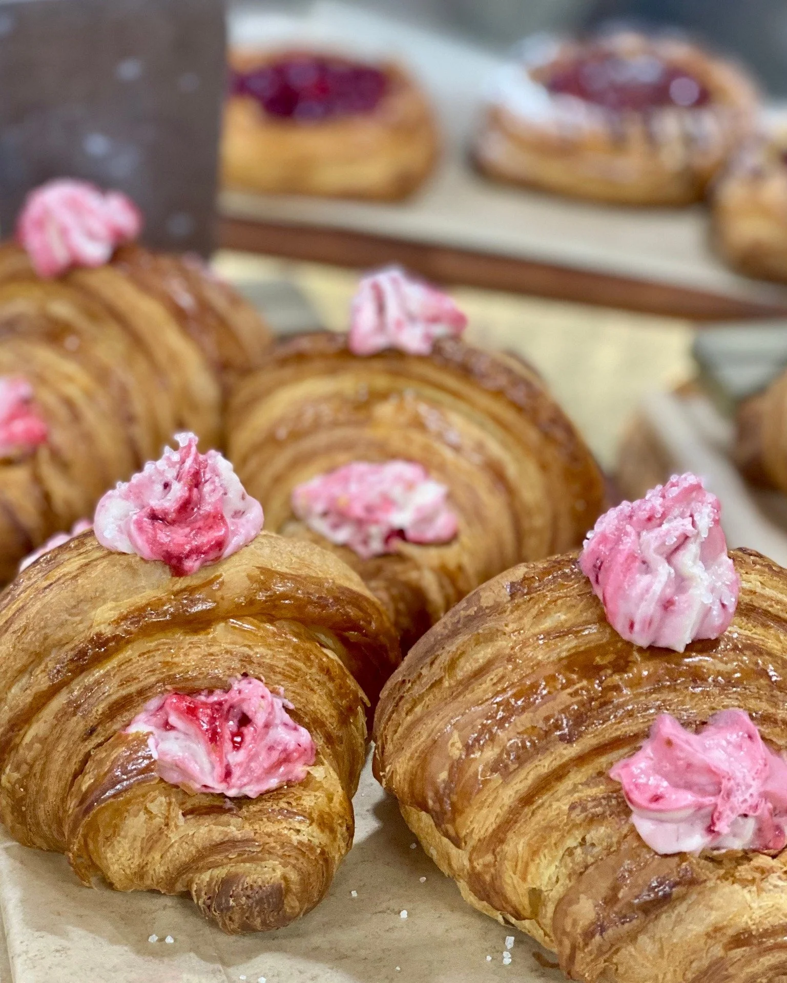 Saturday means we have a full selection of baked goodies! We have Raspberry Cream Croissants, Ham and Swiss Croissants, and the classic Cinnamon Roll-Up!