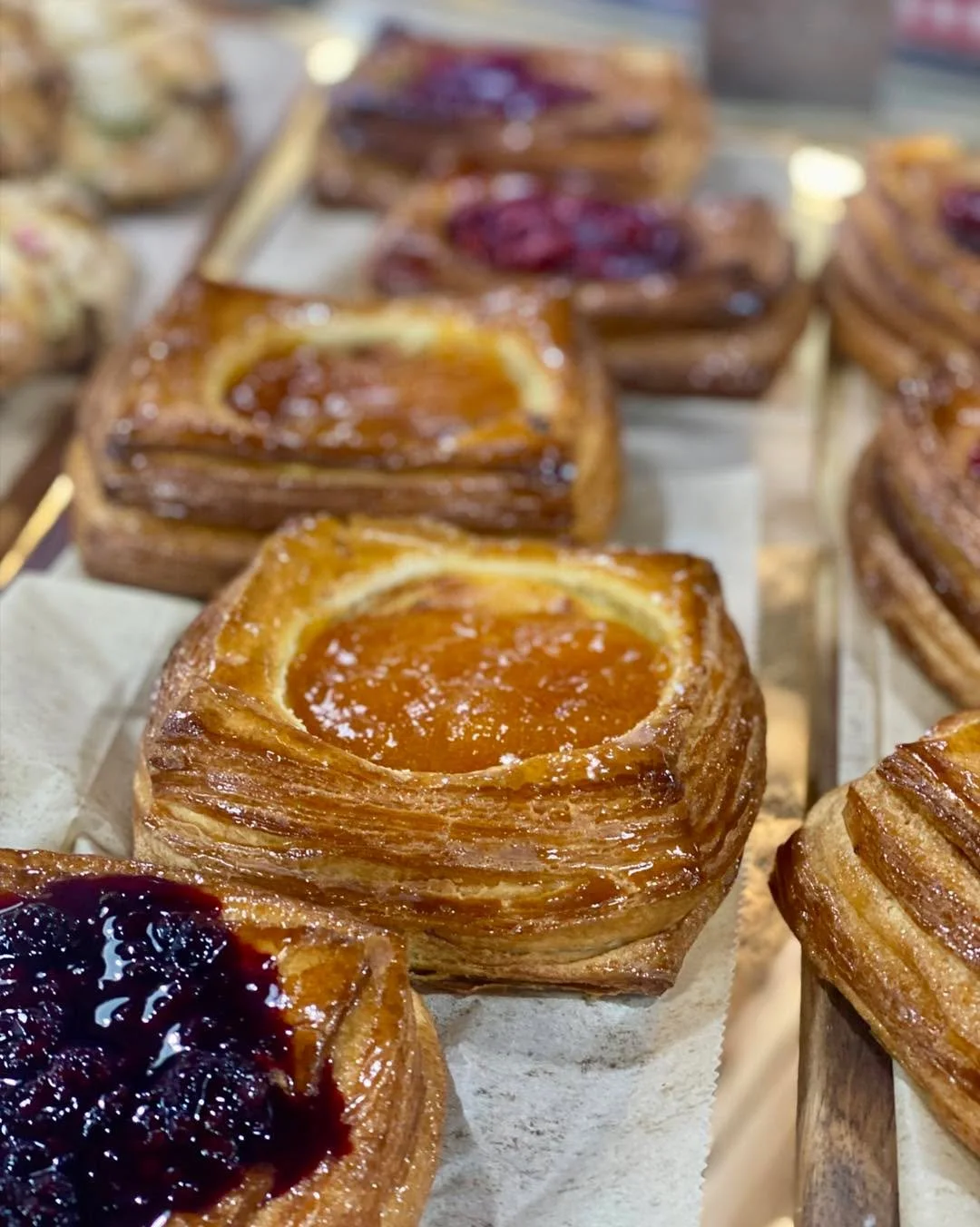 Drool-worthy Danish and other baked goods fresh out of the oven today! Pictured: Plain croissants and Sweet Cream Biscuits.