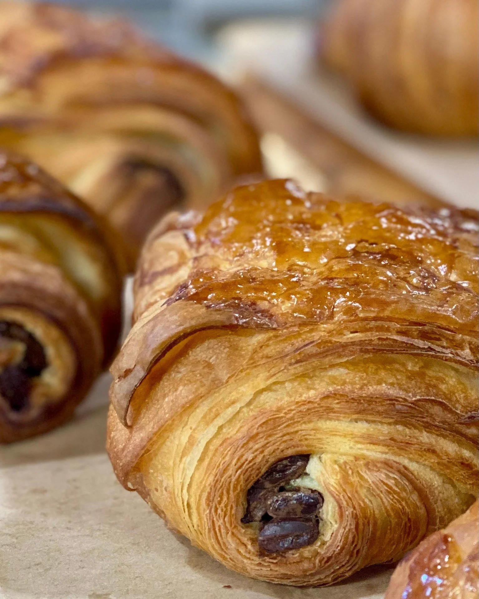 Look at those flaky croissant layers! We have a large variety of croissants, come have a look!