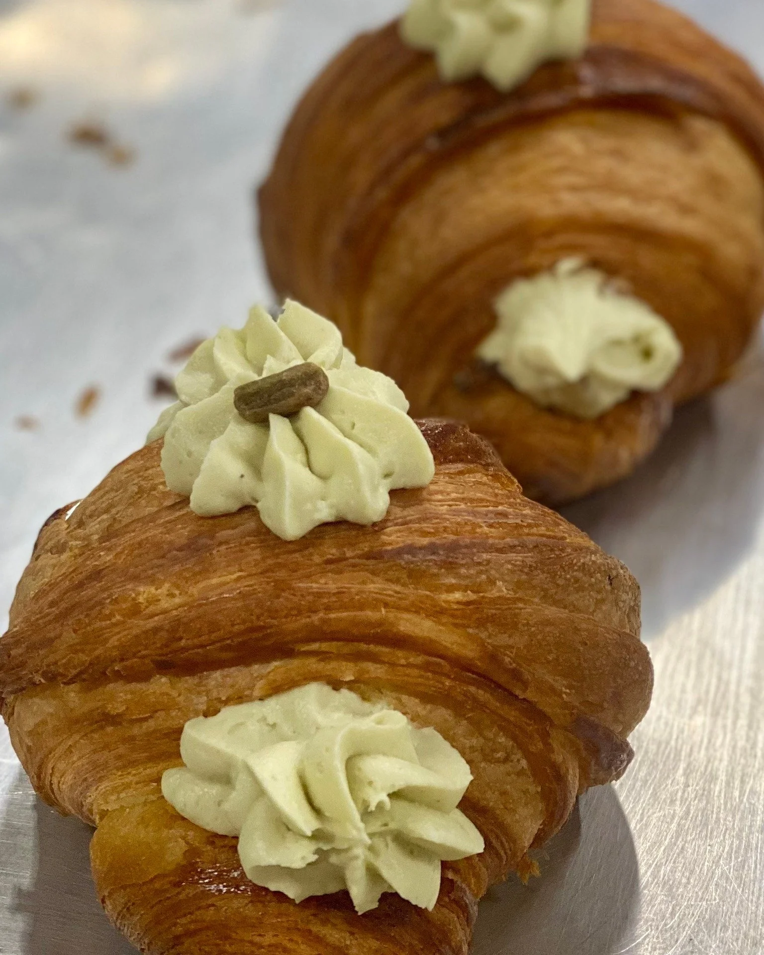 Croissants are filling our bakery case this Saturday! We've got Pistachio Cream Croissants, Nutella Cruffins, and Plain Croissants.