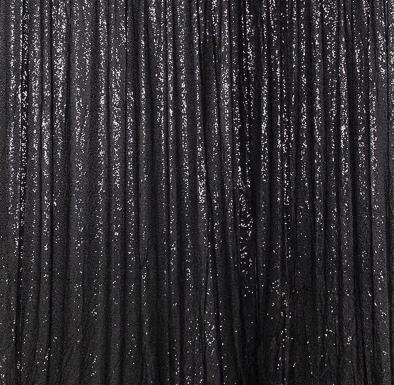 Close-up of shiny black pleated fabric