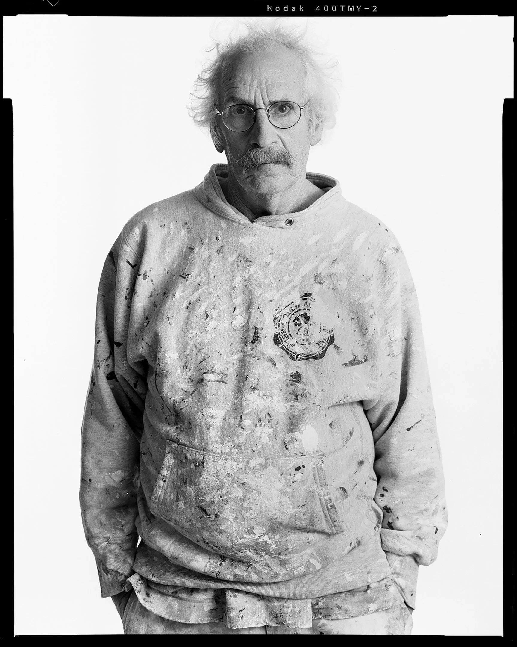 Studio portrait of painter on white background. 