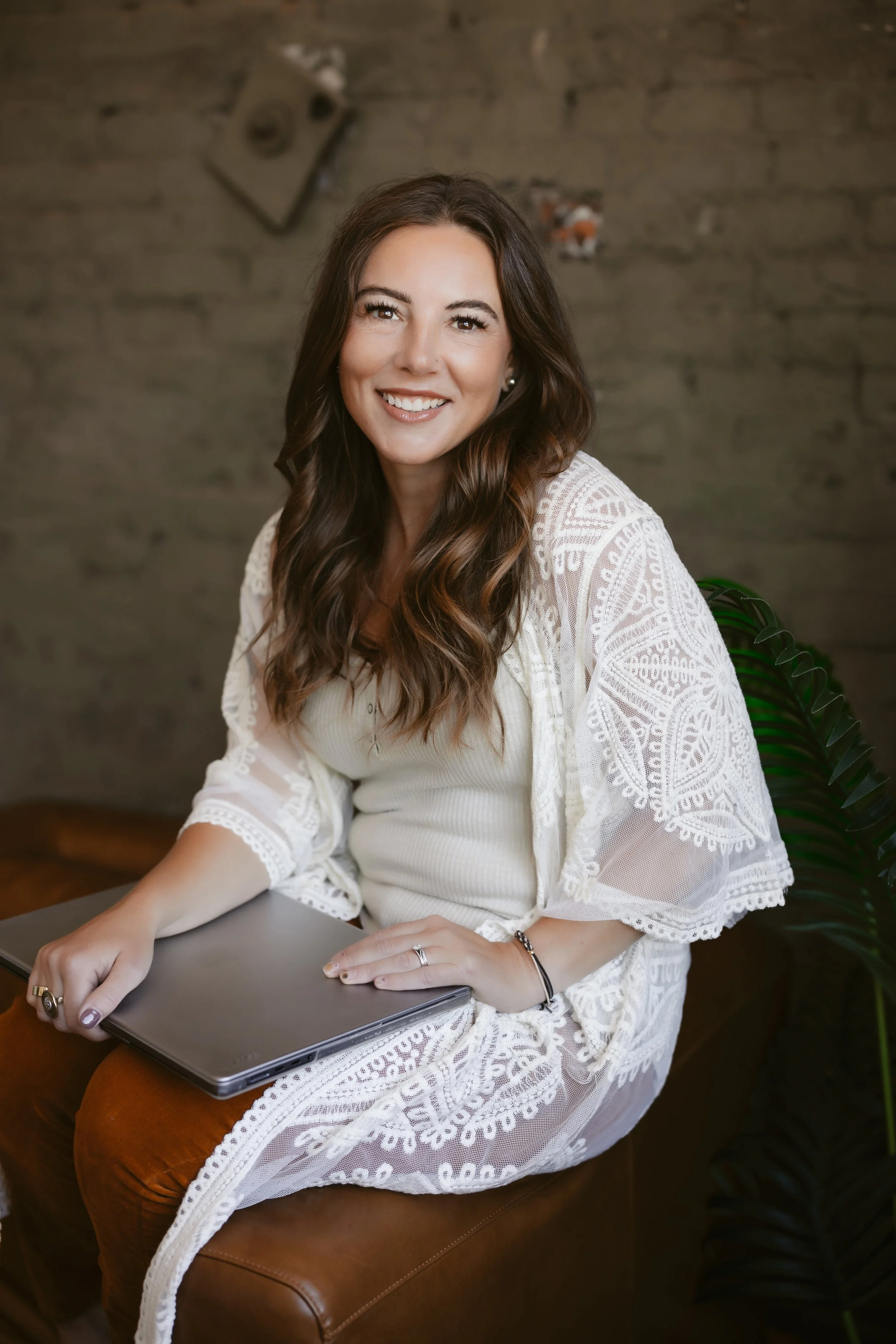 Creative branding portrait of a Lafayette-based designer in their studio, surrounded by design materials and tools.