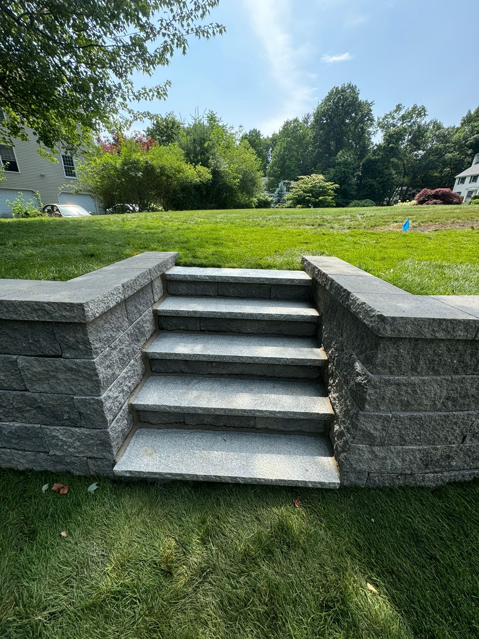 A LADDER MADE IN MASONRY, WITH BLOCKS, CONCRETE AND STONES