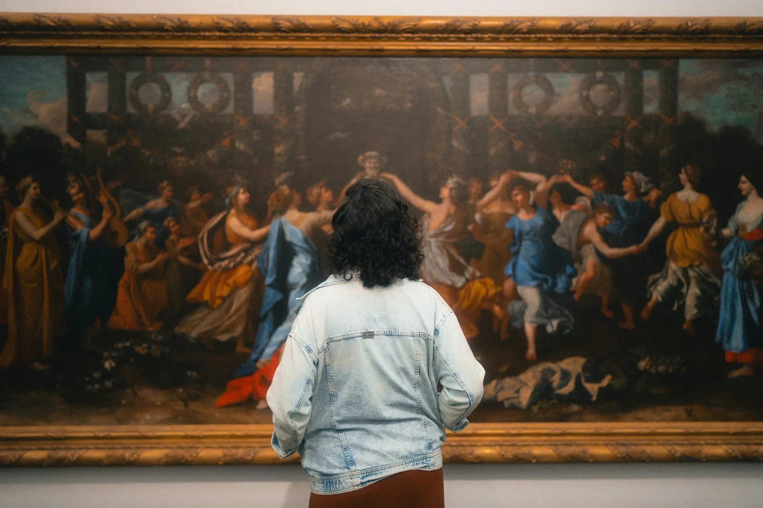 A person stands in an art gallery